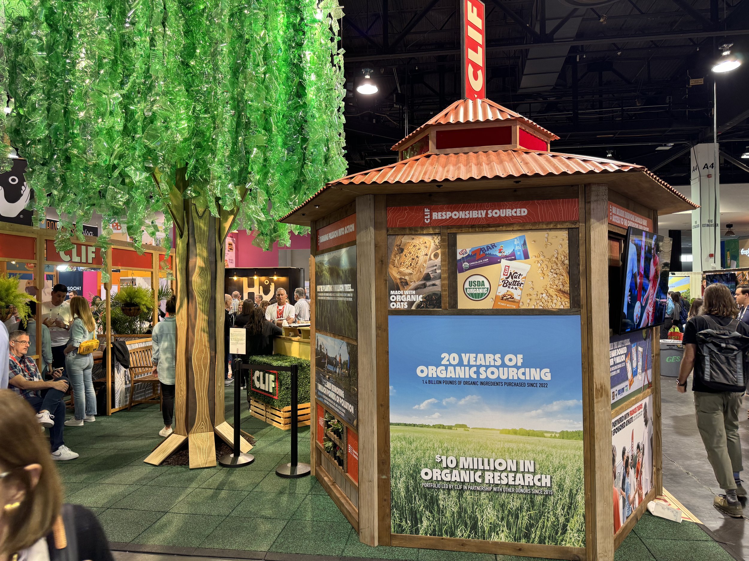 Clif reclaimed wood panels converted into a gazebo, each panel sharing a company focus or accomplishment. The diverted waste tree.