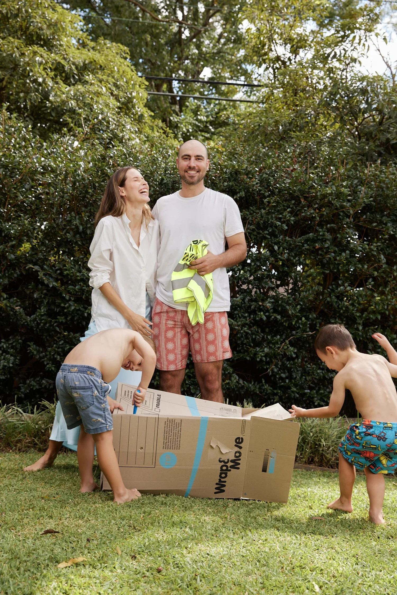 Family carrying moving boxes on moving day