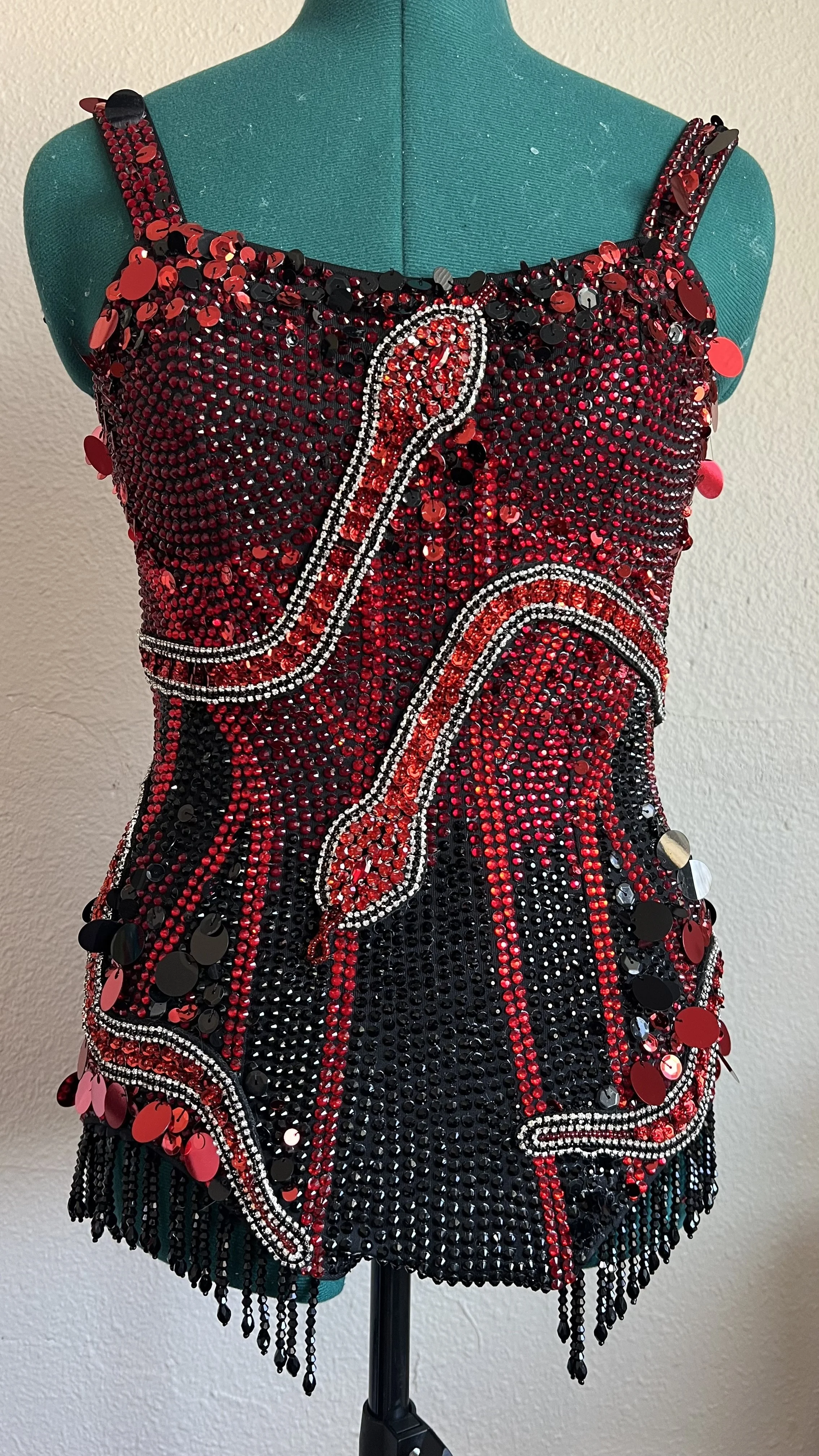 Black and Red Rhinestone and sequin Snake bodysuit on a mannequin inspired by Taylor Swift's Eras Tour Reputation bodysuits
