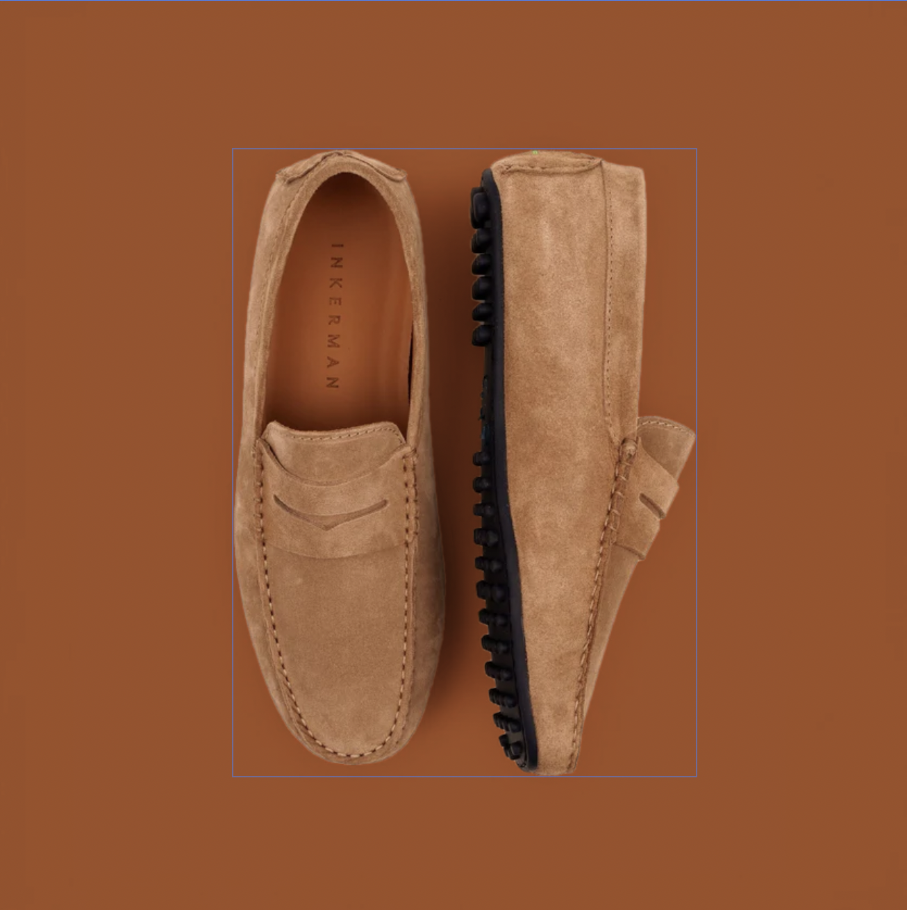 Brown suede moccasin shoes on brown background