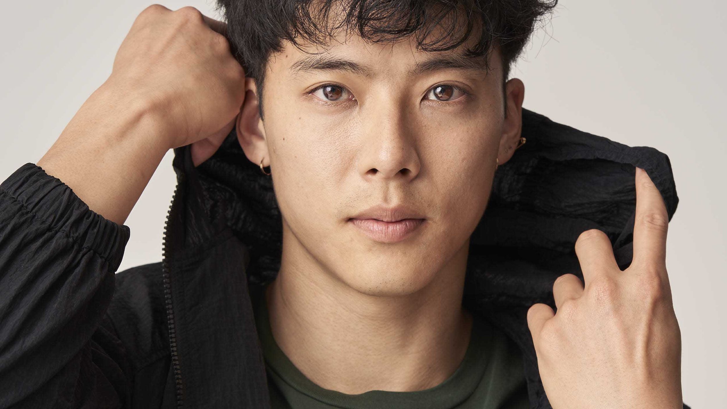 Person wearing black jacket, close-up