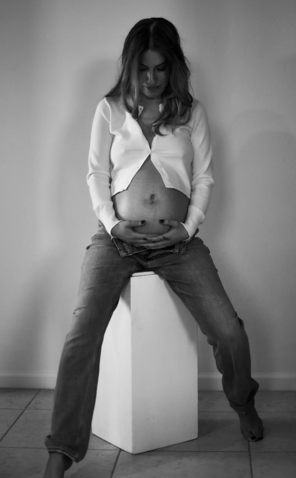 An expecting mother photographed during a Tucson maternity photo shoot. This editorial maternity portrait celebrates pregnancy and motherhood with elegant styling and fine art maternity photography by a Tucson maternity photographer.