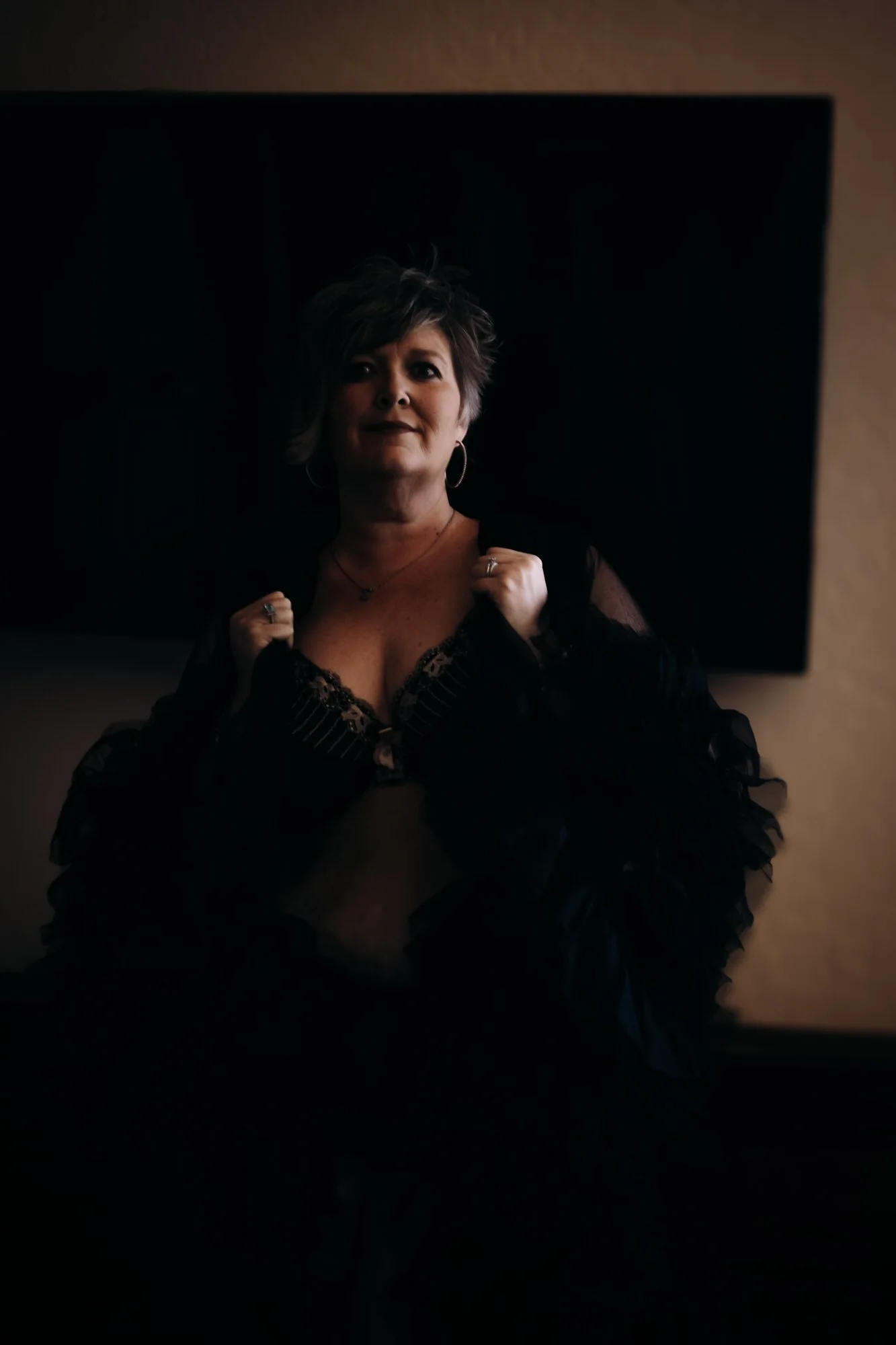 Woman over 50 during a boudoir photography session celebrating confidence and femininity in Tucson, Arizona by Rebekah Ayantola.