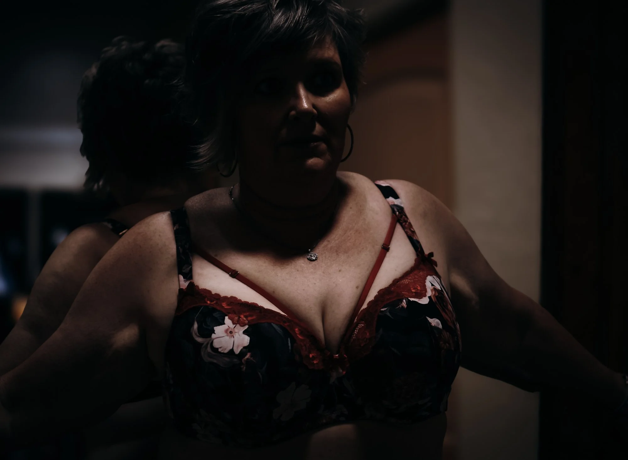 Moody fine art boudoir portrait celebrating beauty and confidence at every age.