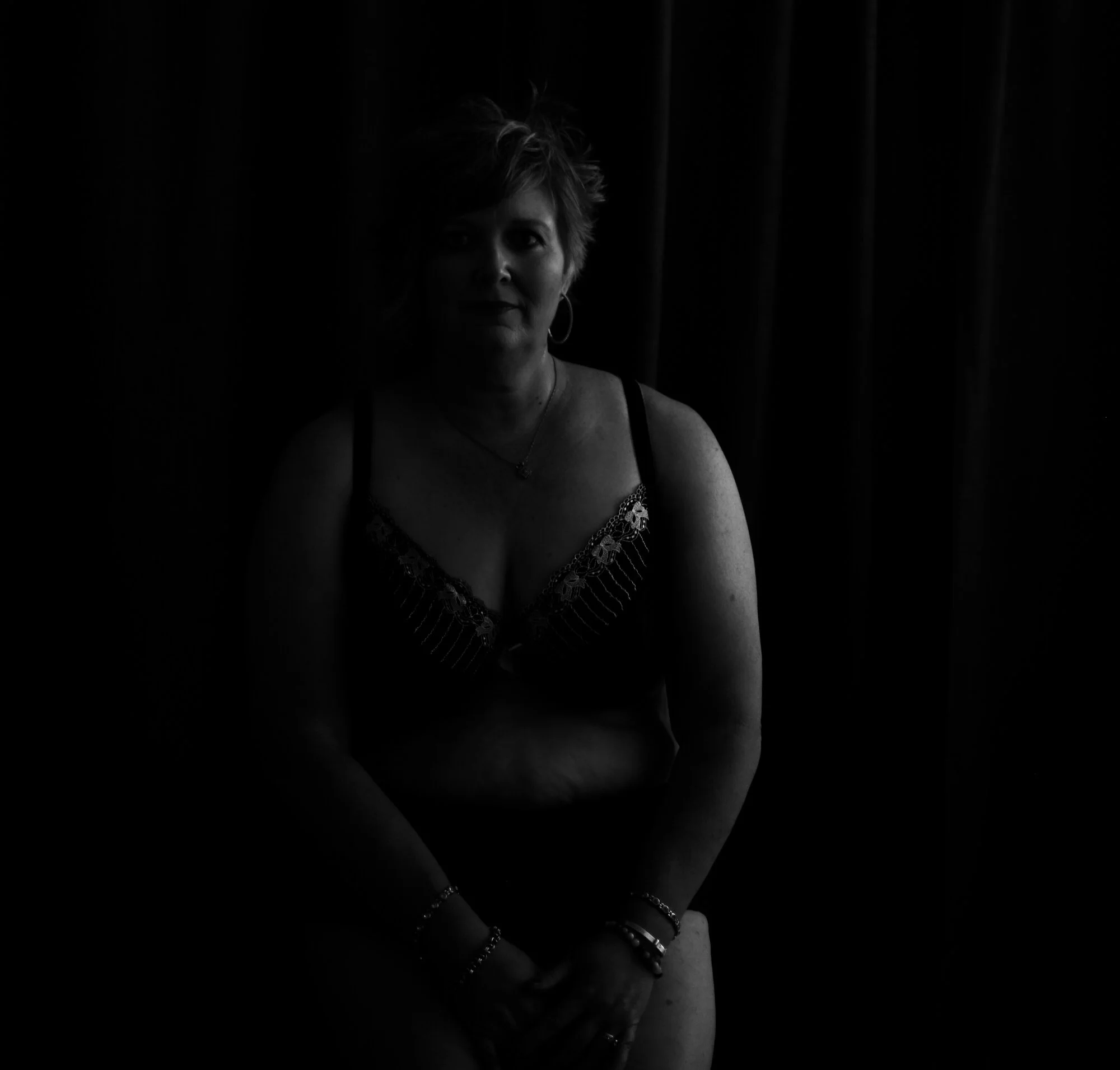 Fine art boudoir portrait showcasing confidence and grace after 40.