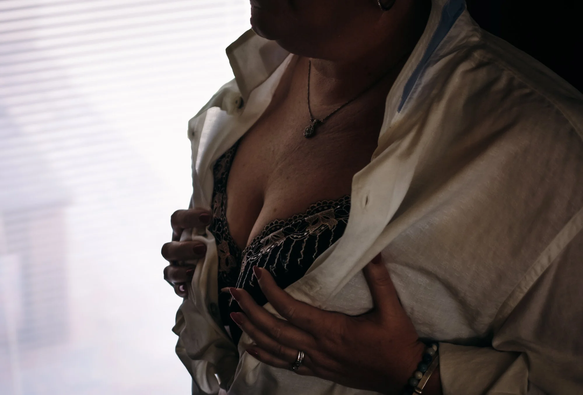 Elegant boudoir photography for women over 40 focused on confidence and self-acceptance.