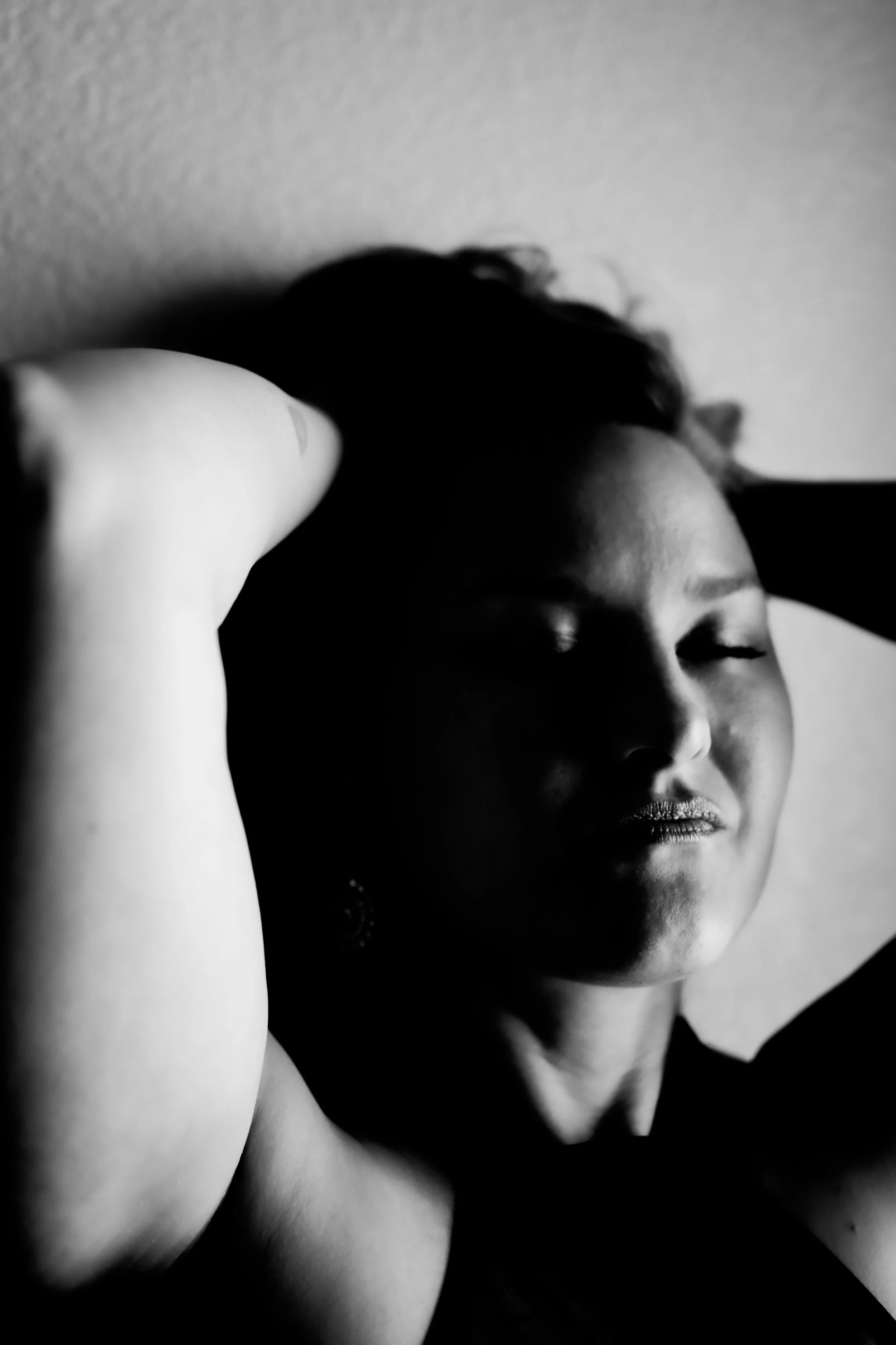 Black and white boudoir portrait with soft lighting by best photographer in Tucson, elegant photography