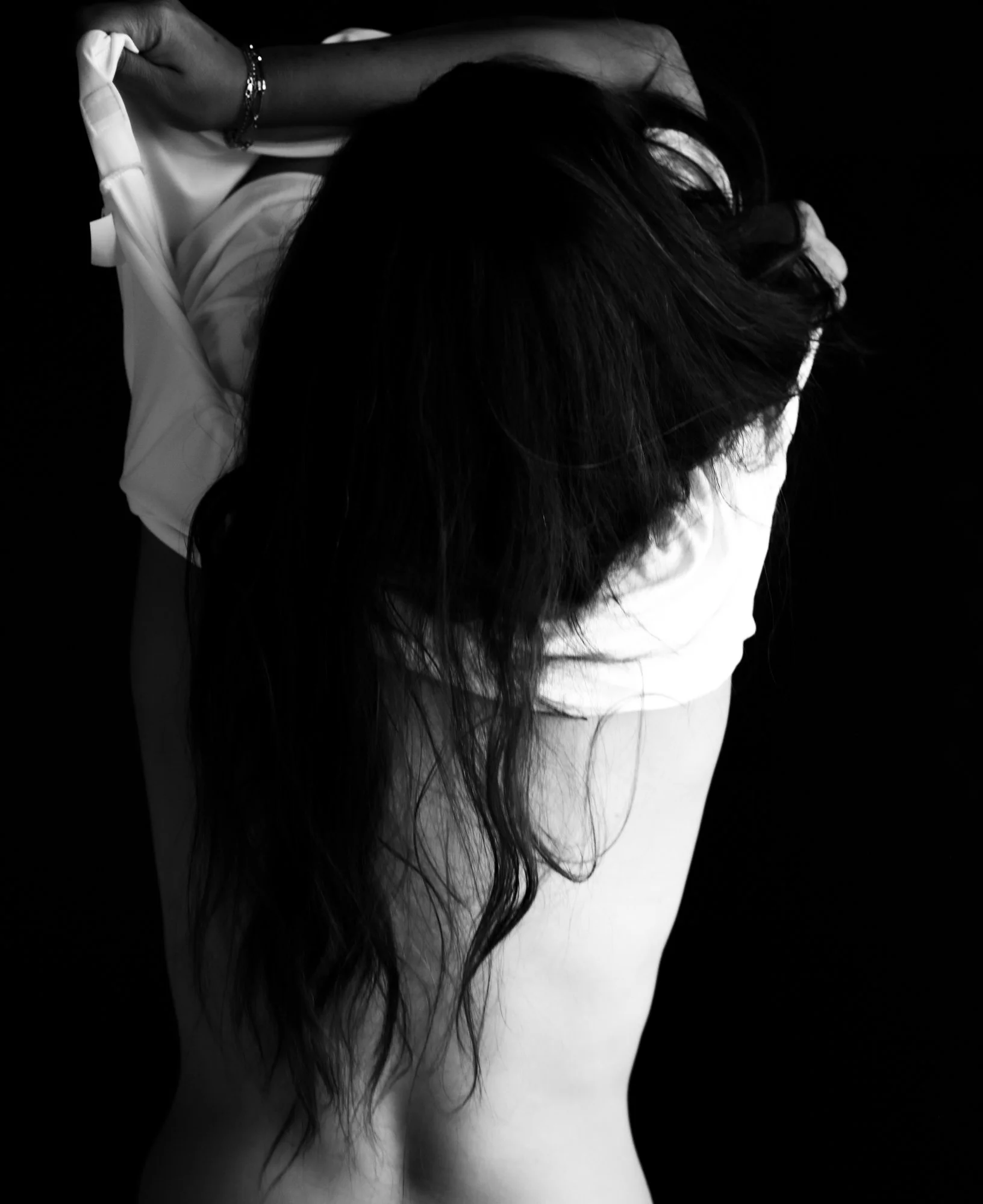 Minimal and moody window light creates a timeless, fine art boudoir silhouette.