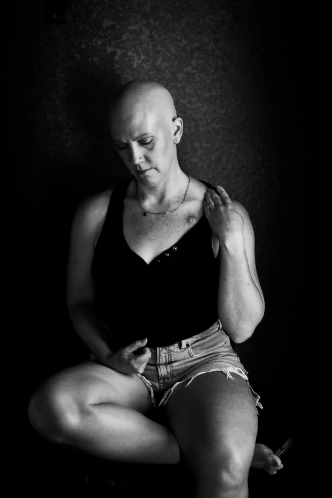 A powerful warrior portrait celebrating triumph over adversity. Photographed in Tucson, Arizona by Rebekah Ayantola, this empowering portrait honors women who have battled cancer, illness, loss, or personal struggles and emerged stronger.