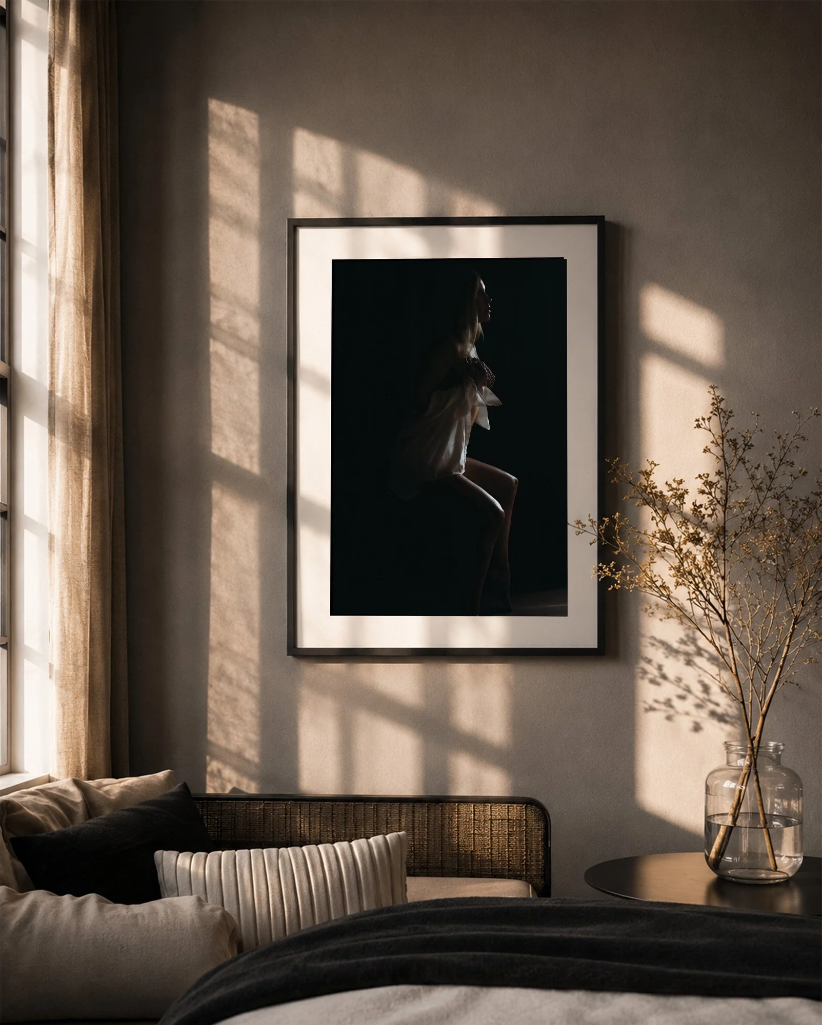 Fine art boudoir portrait displayed as framed wall art in a luxury living room by Tucson photographer Rebekah Ayantola.
