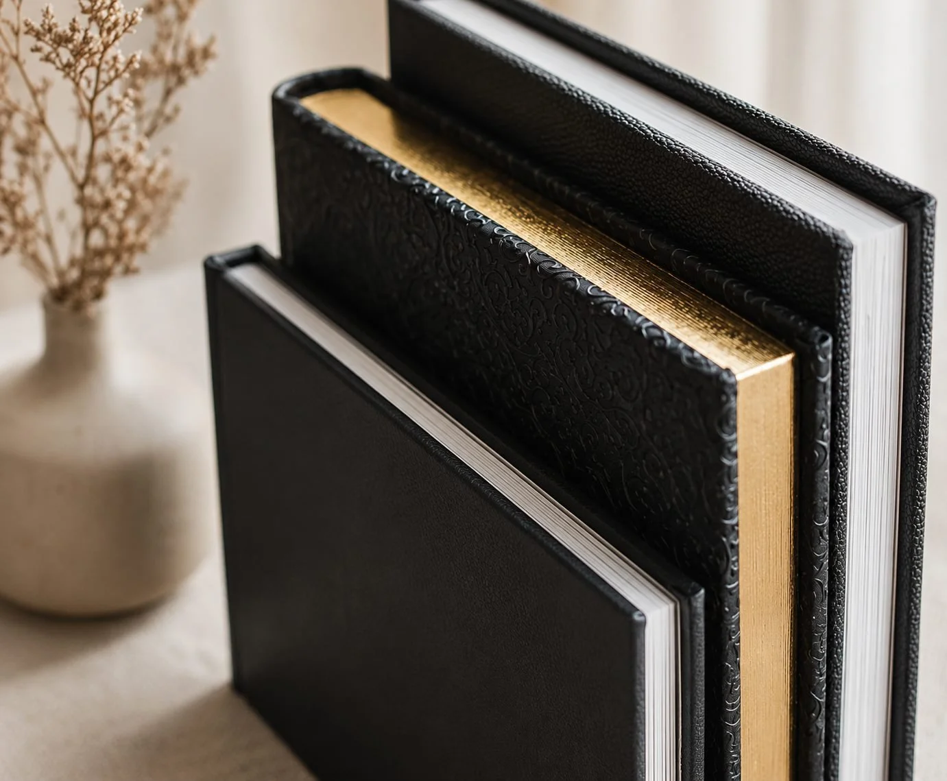 Luxury black leather boudoir photo albums by Tucson, Arizona photographer Rebekah Ayantola.