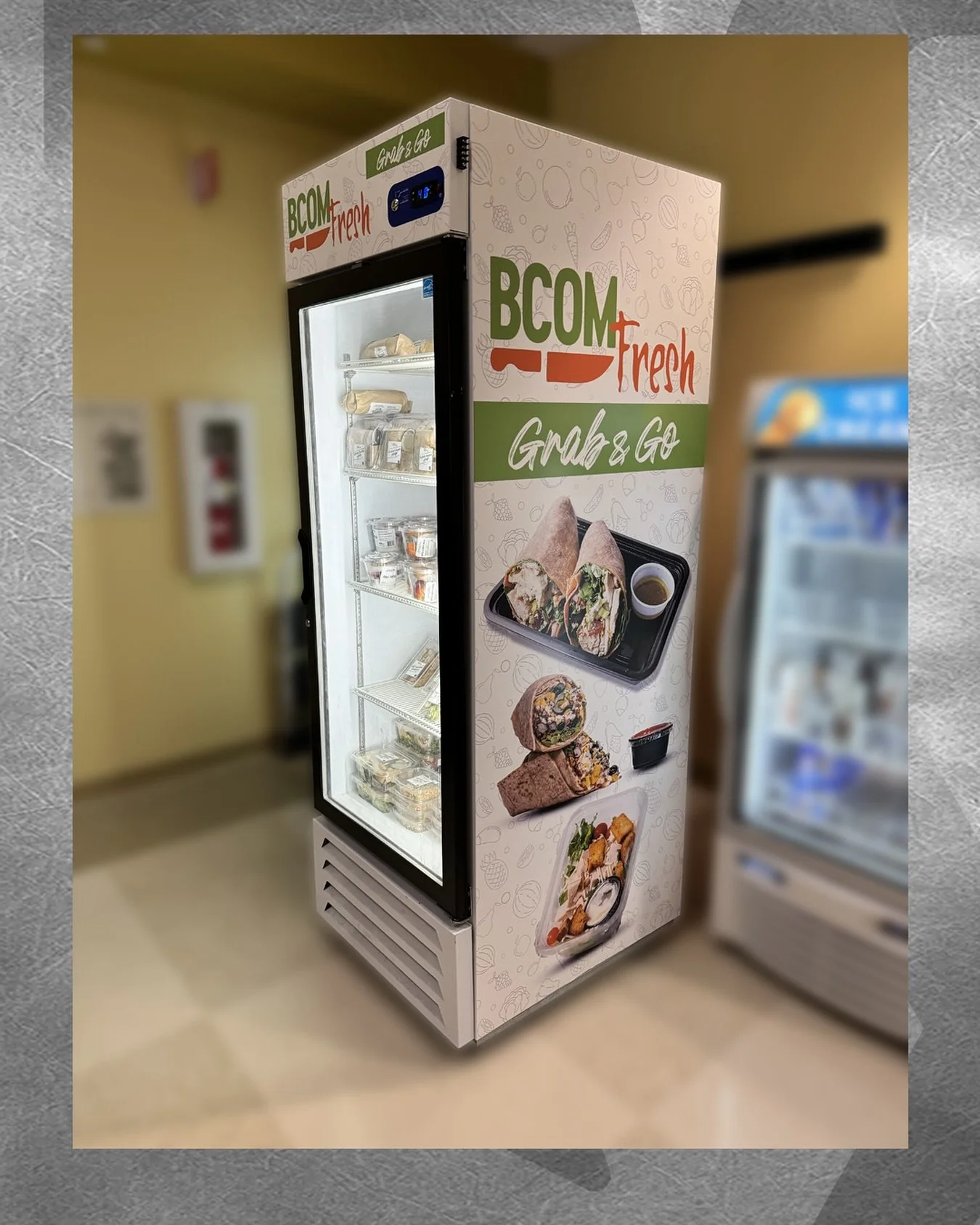 Project Profile: &ldquo;BCOM Fresh&rdquo; Fridge Wrap

&bull;	To support the launch of their new meal prep line, we designed, produced, and installed a full fridge wrap that transforms a simple cooler into a vibrant brand statement. Now, every grab-a
