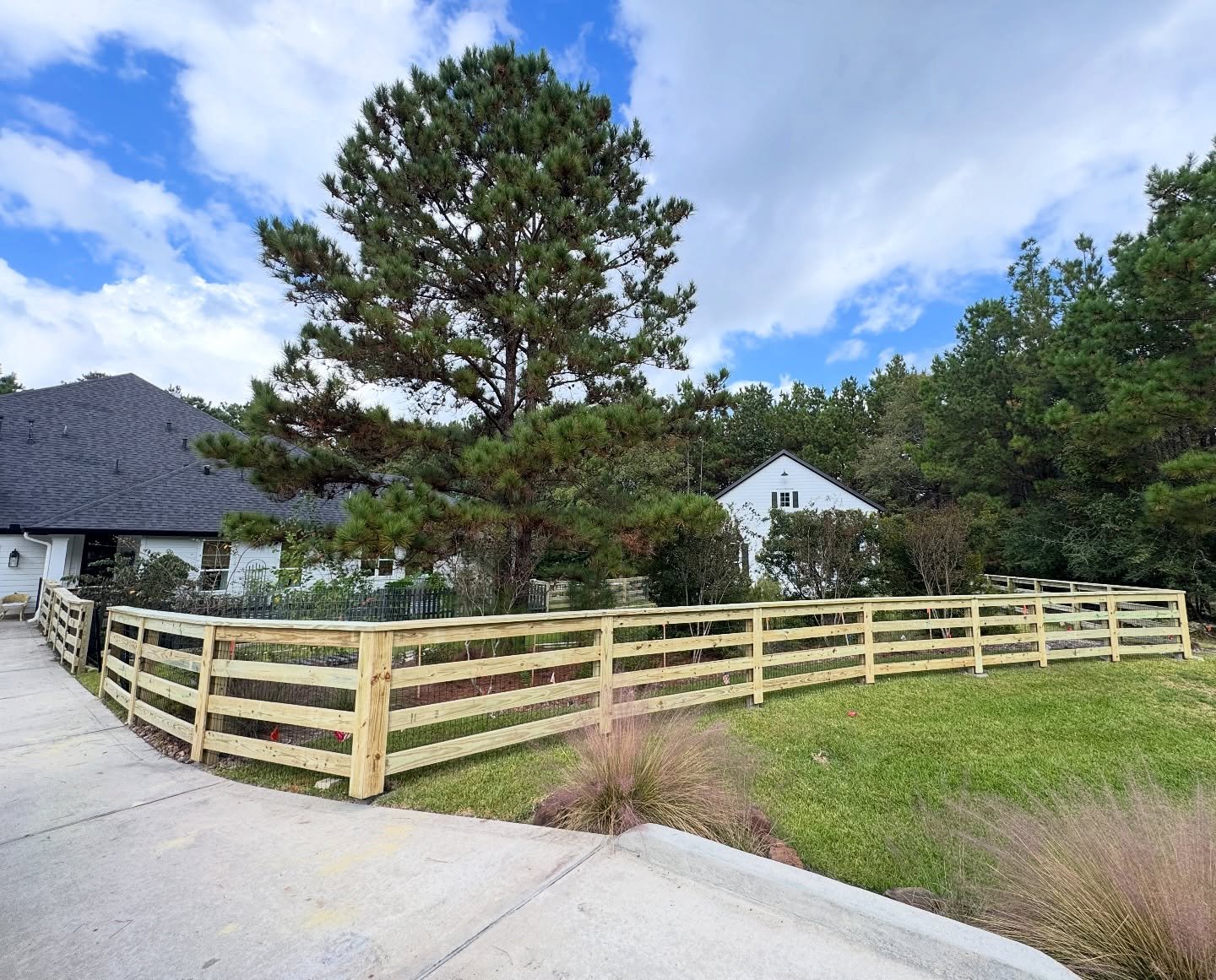 Nothing beats the satisfaction of a clean, solid build. This custom 4-rail ranch-style fence was designed to complement the home and landscape while built tough to last. Proudly crafted by Fences by Craig &mdash; where quality and care go hand in han