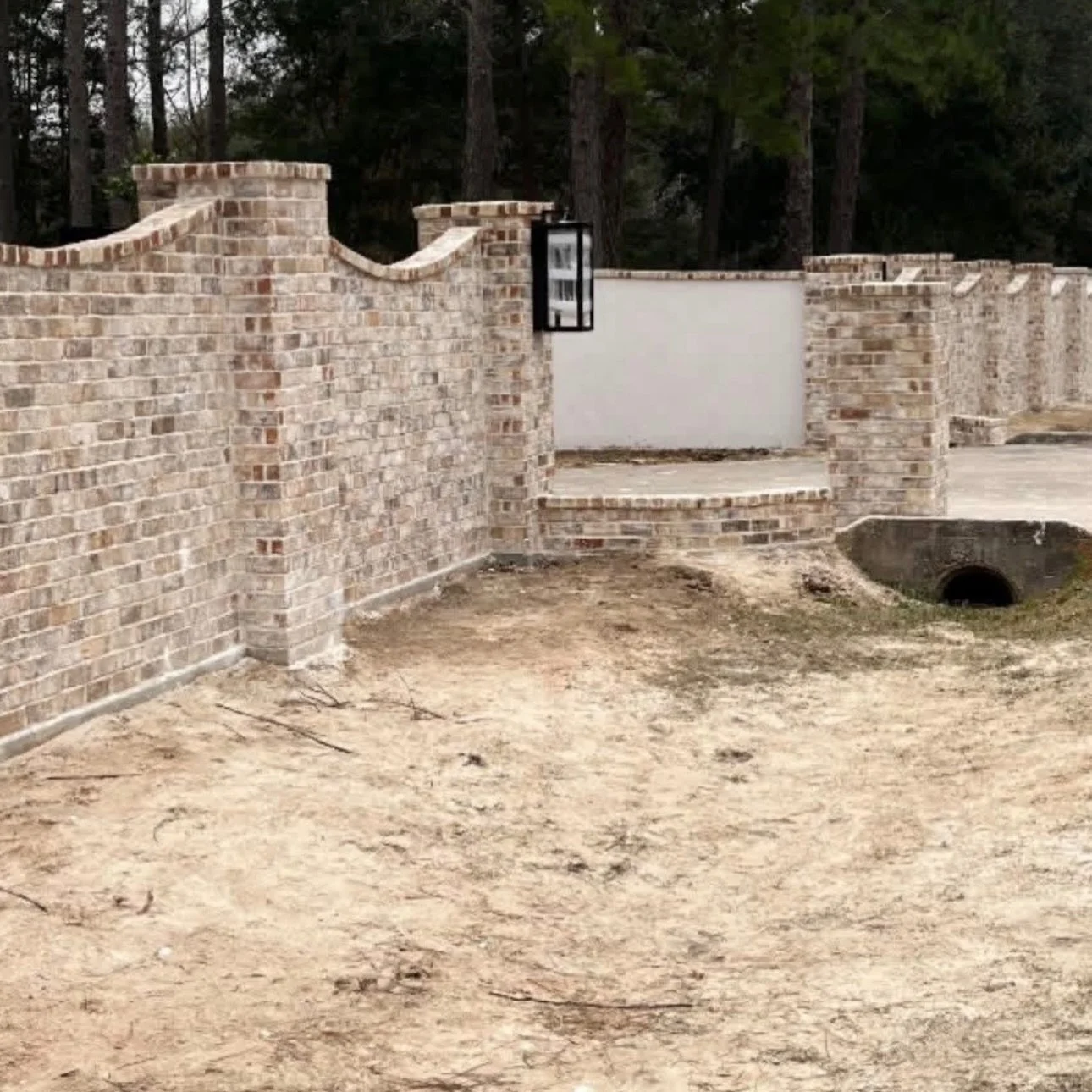 Clean lines. Custom curves. Built to last. 🔥

Brick privacy wall done right &mdash; precision, symmetry, and craftsmanship in every detail. From long perimeter runs to statement entry features, we don&rsquo;t just build fences&hellip; we build first