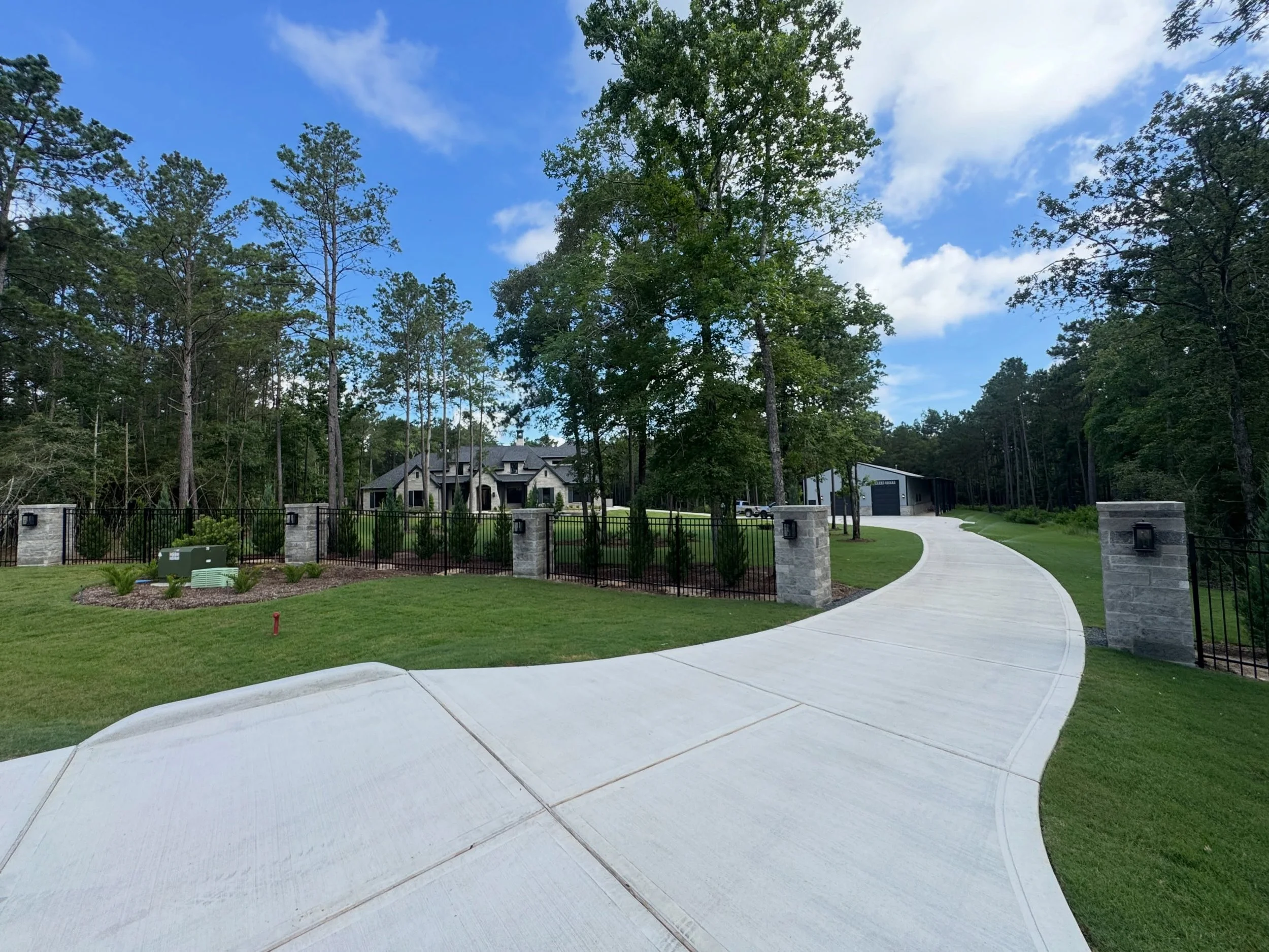 A fence should do more than mark a property line&mdash;it should make a statement. 🔥

This project features custom ornamental iron fencing with stone columns across the front of the property, creating a grand entrance that blends security, elegance,