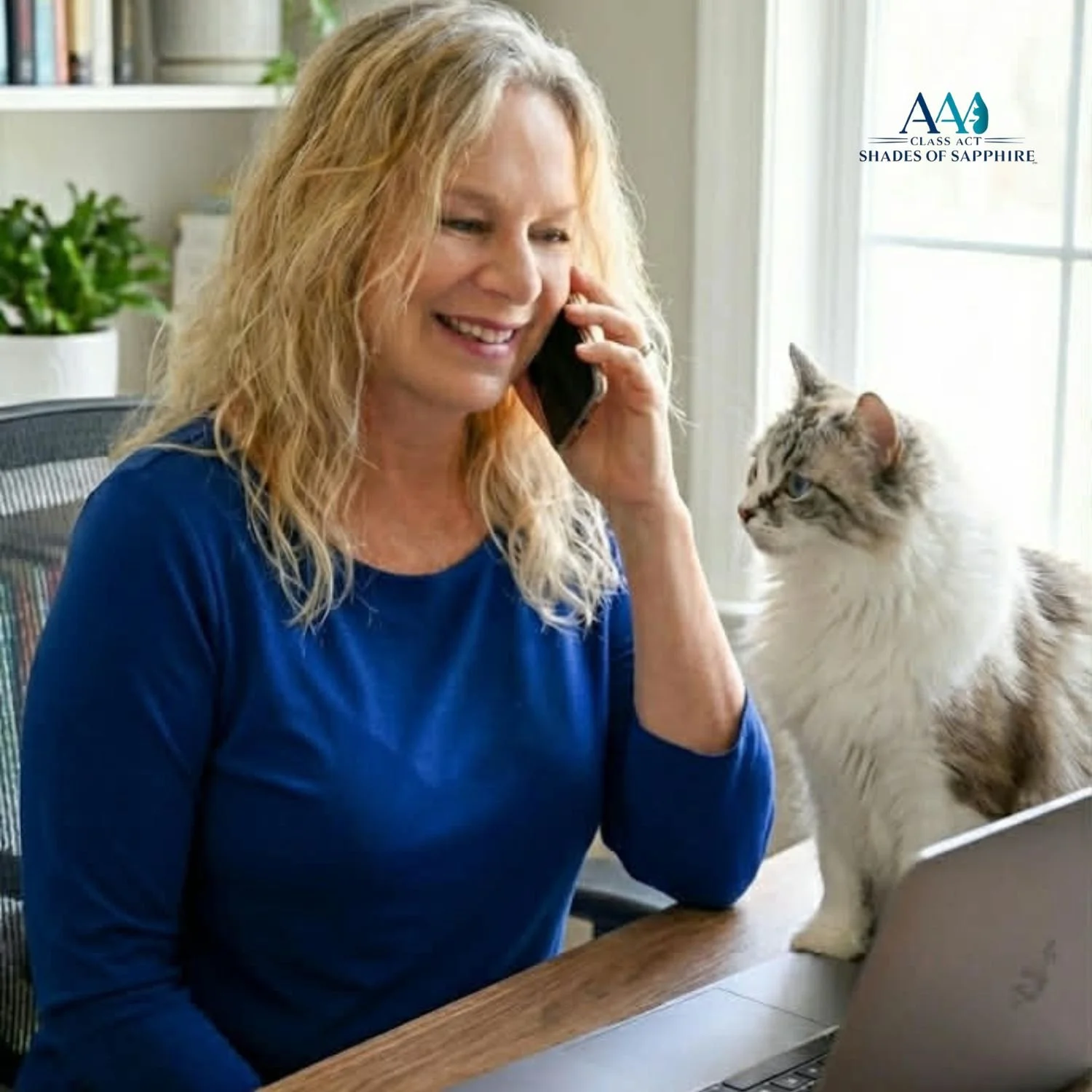 Ragdoll breeder speaking with an approved family while working from her home office, with Caraline the Ragdoll cat by her side.