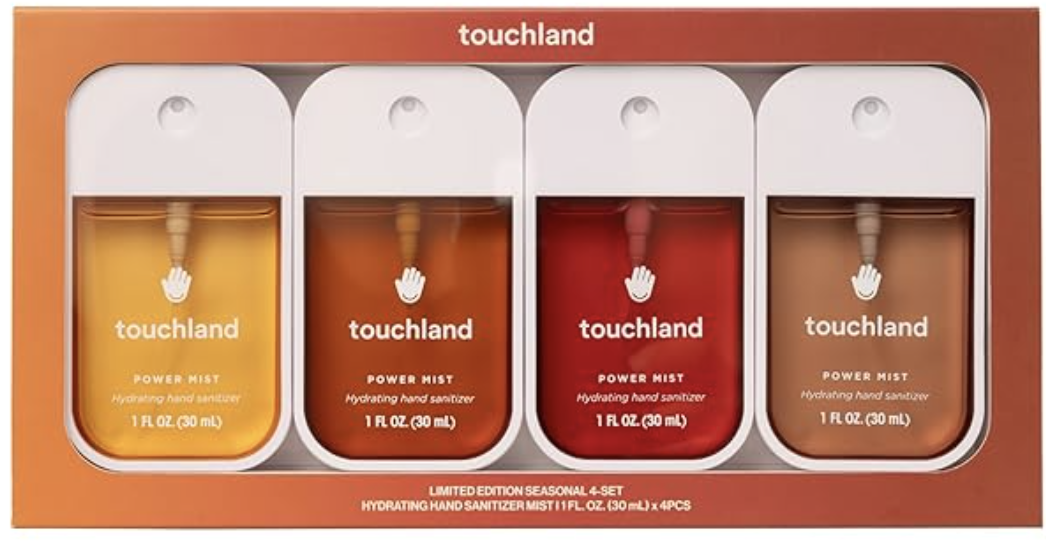 This image features a stylish touchland hand sanitizer gift set displayed neatly and aesthetically. The set includes slim,  power mist bottles arranged in a row. The packaging has a minimal, sleek design.