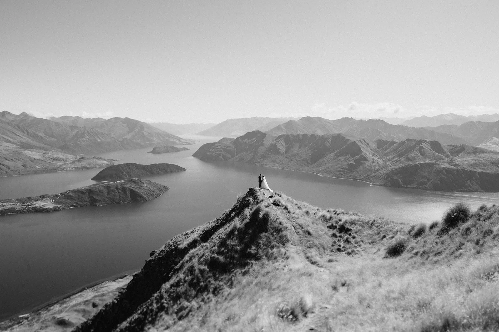 View across the mountains at Rippon in Wānaka, inspiring the hand-drawn illustration used throughout the wedding stationery.
