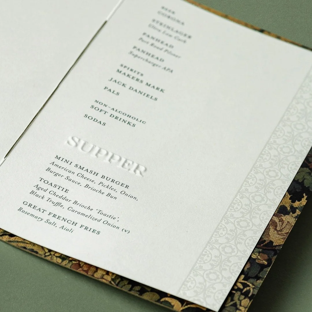Detail of Angela and Justin’s wedding bar menu, combining the Putiki tile pattern with tapestry artwork and blind embossed typography.