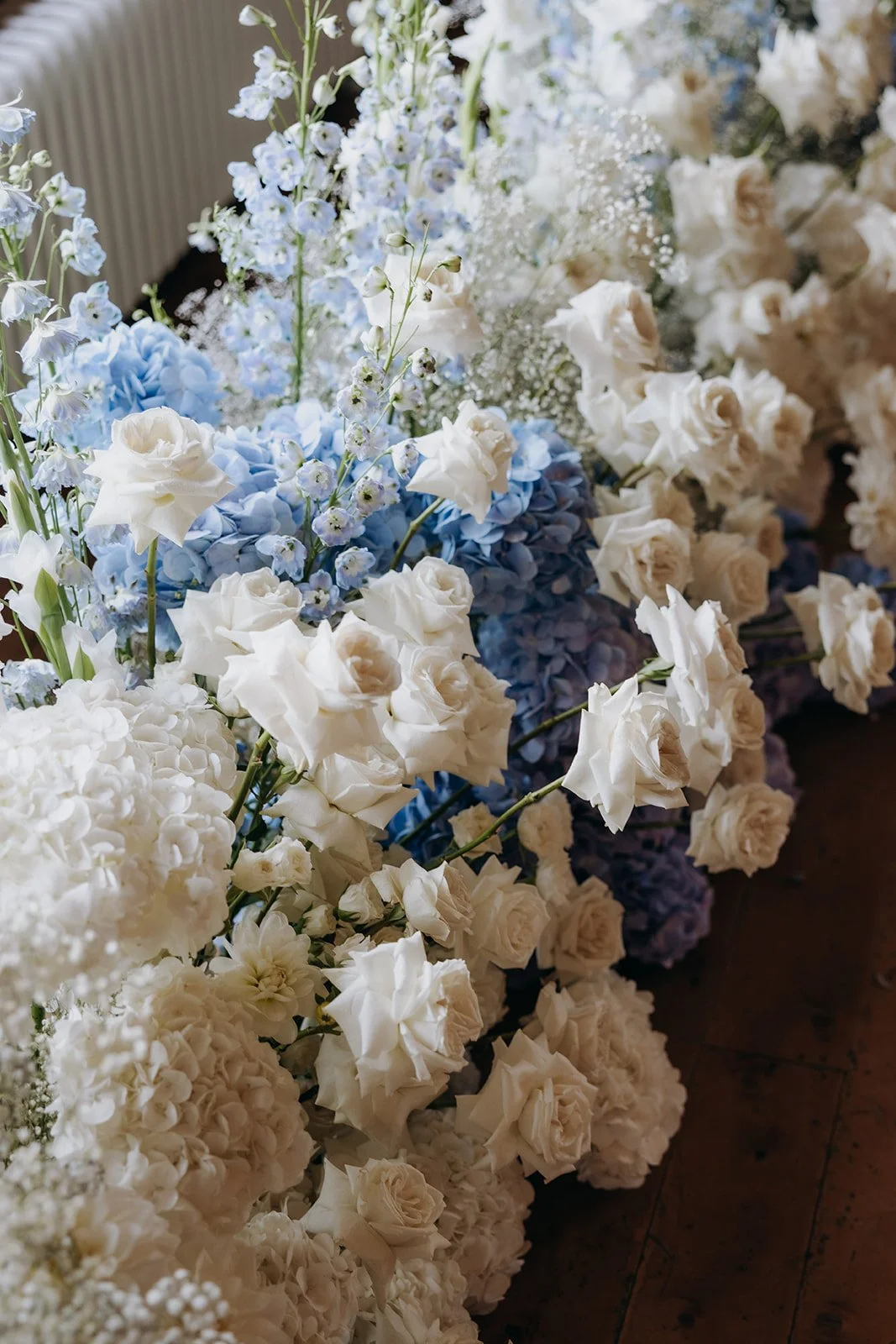 Blue and white wedding flowers reflecting the colour palette used throughout the stationery suite at Rippon in Wānaka.