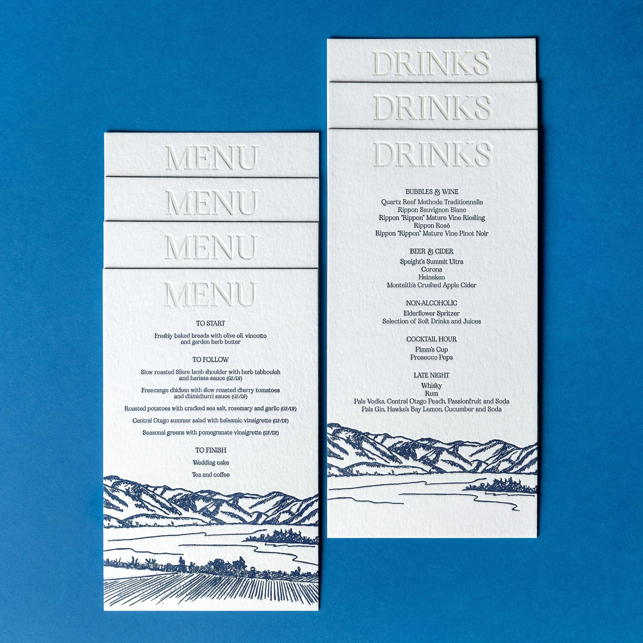 Letterpress wedding menu and drinks menu featuring blind debossed headings and a hand-drawn landscape illustration inspired by Rippon in Wānaka.