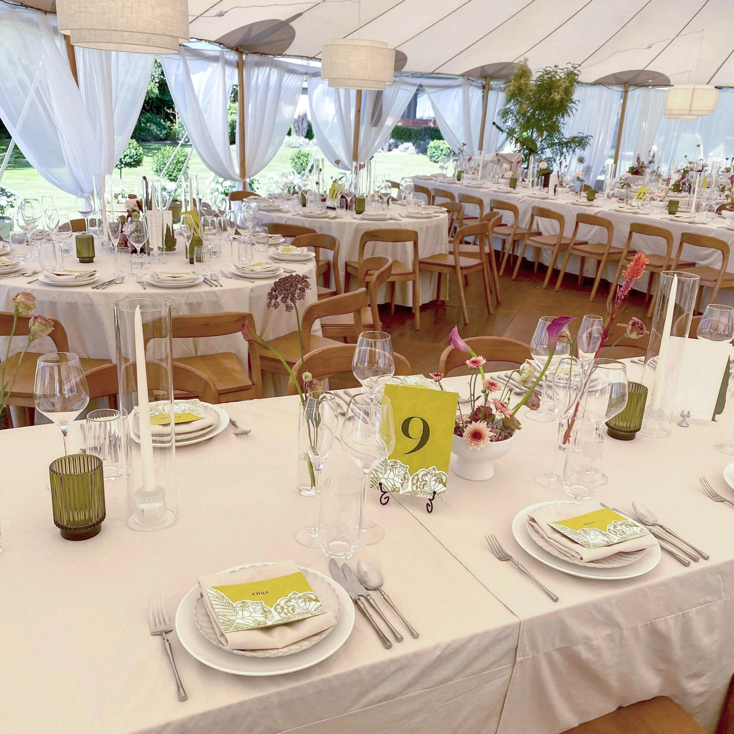 Greer and Cohen’s garden wedding reception, with botanical place cards and table numbers styled across the tables.