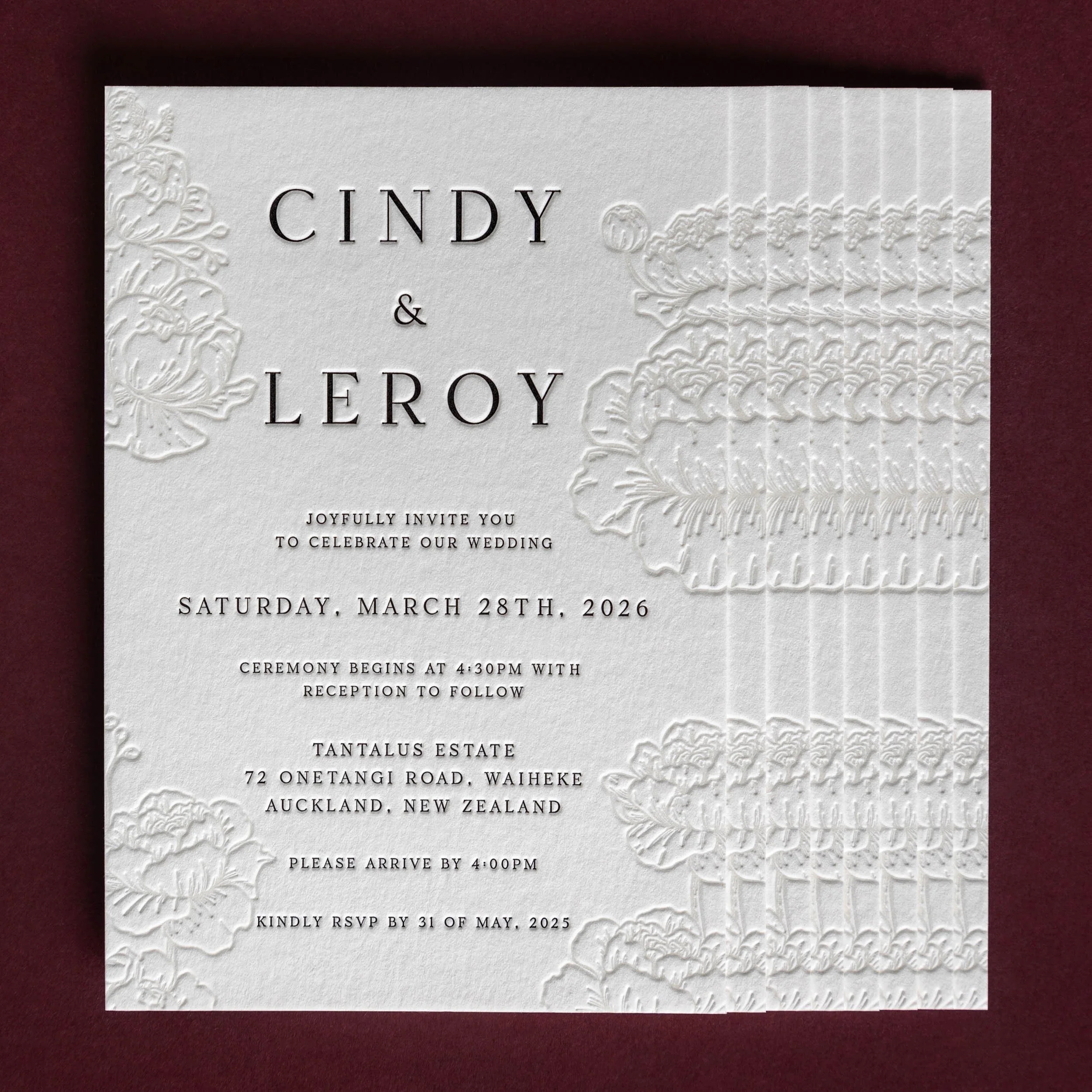 Letterpress wedding invitation with repeated peony illustrations creating texture and depth across the design.