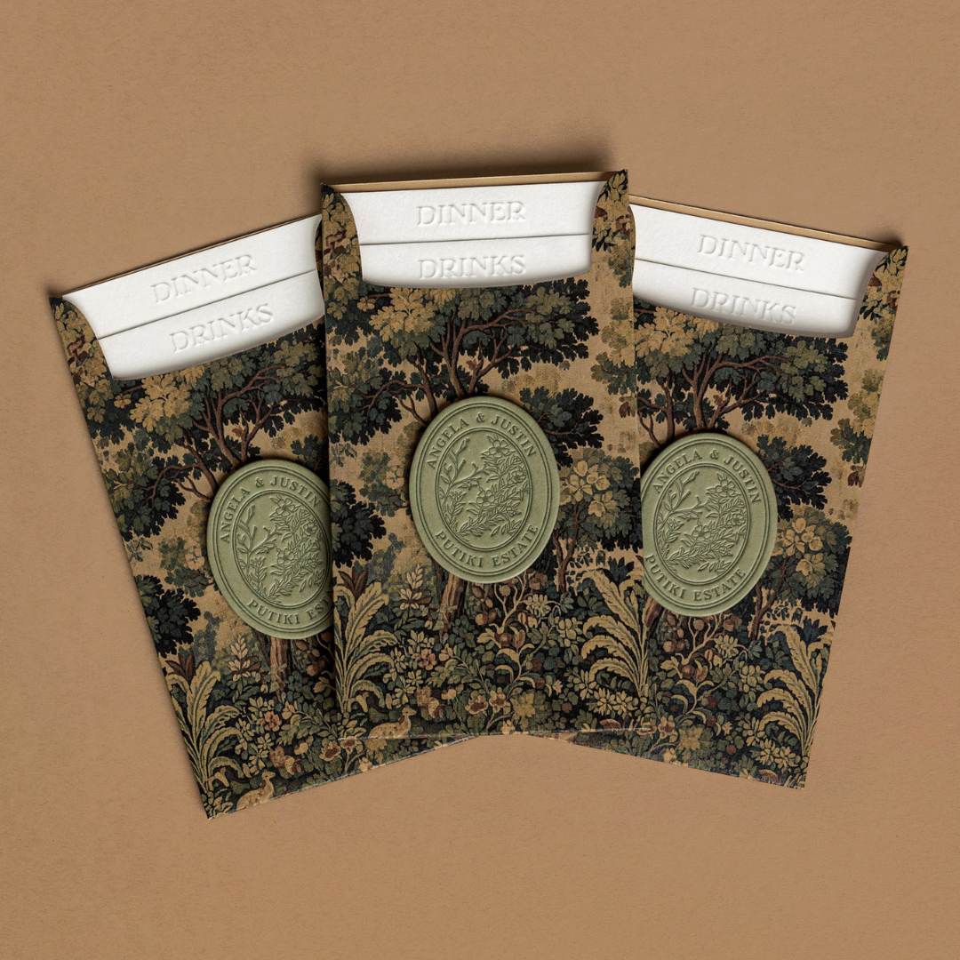 Angela and Justin’s custom wedding dinner and drinks menus with embossed titles, layered construction and personalised crest.