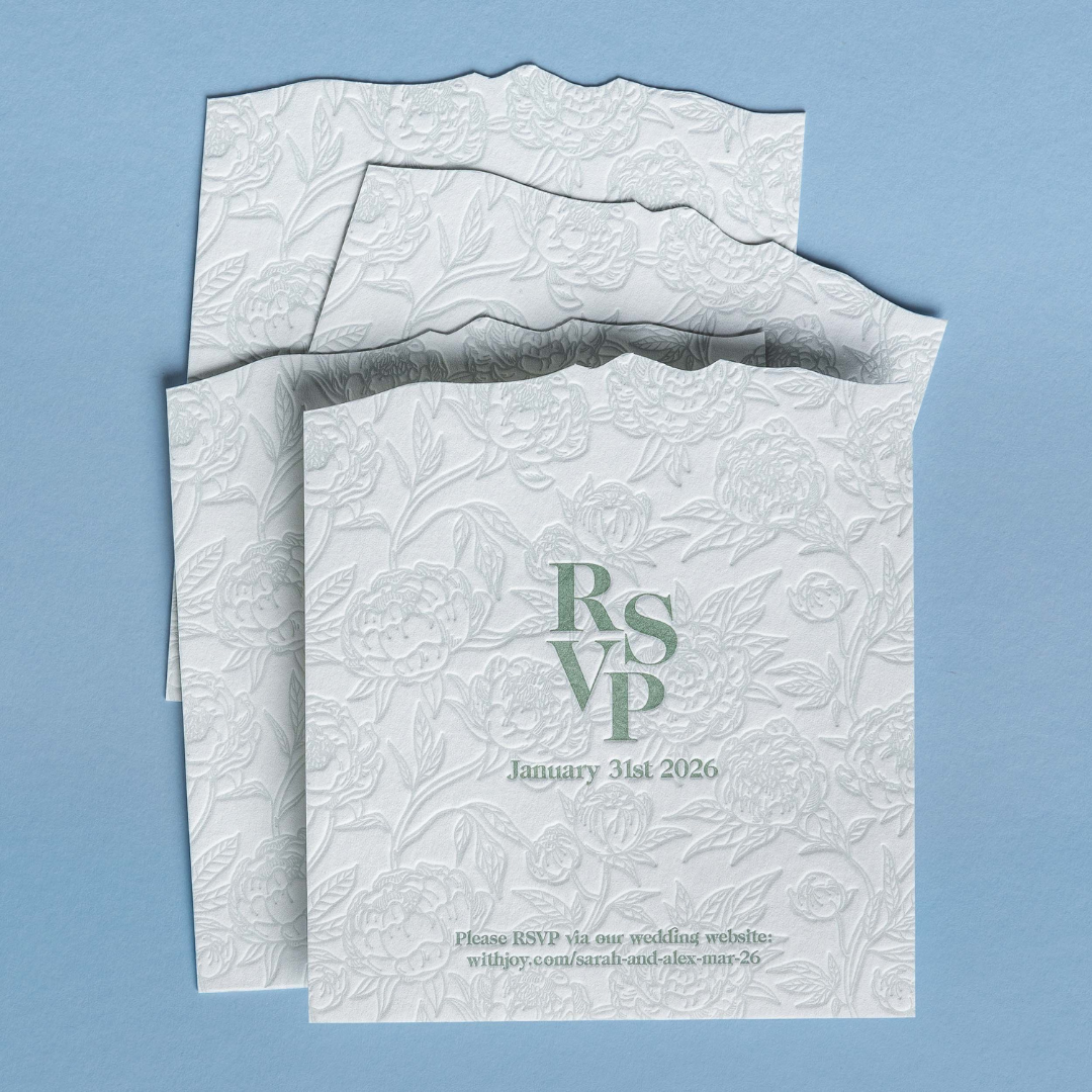 Letterpress RSVP card featuring debossed peonies and soft green typography for Sarah and Alex's Queenstown wedding invitation suite.