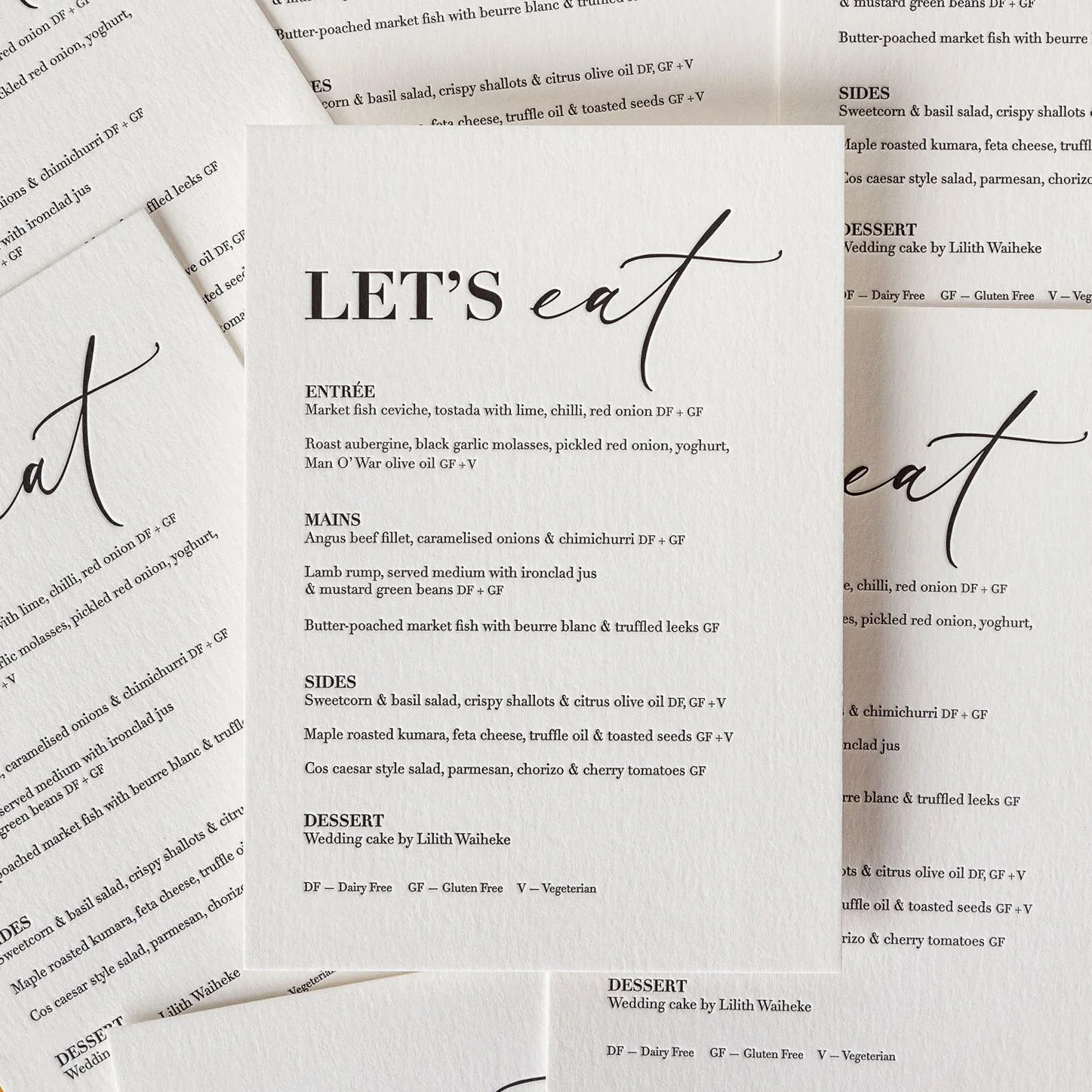 Emma and Daniel's A5 letterpress wedding menu with crisp black typography printed on heavyweight cotton paper.