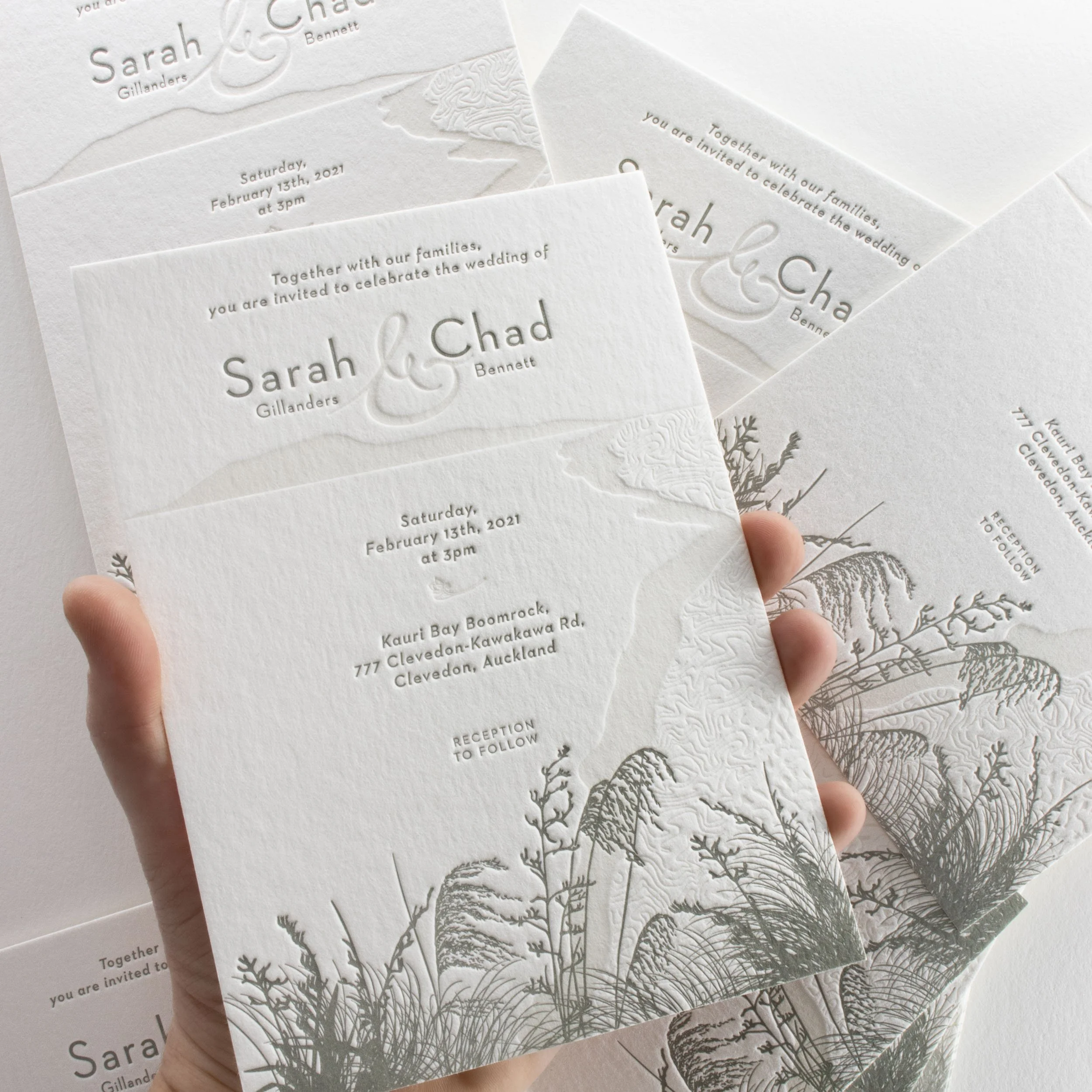 Beach-inspired letterpress wedding invitation featuring coastal native plants, printed on luxurious cotton card, designed and crafted in New Zealand.