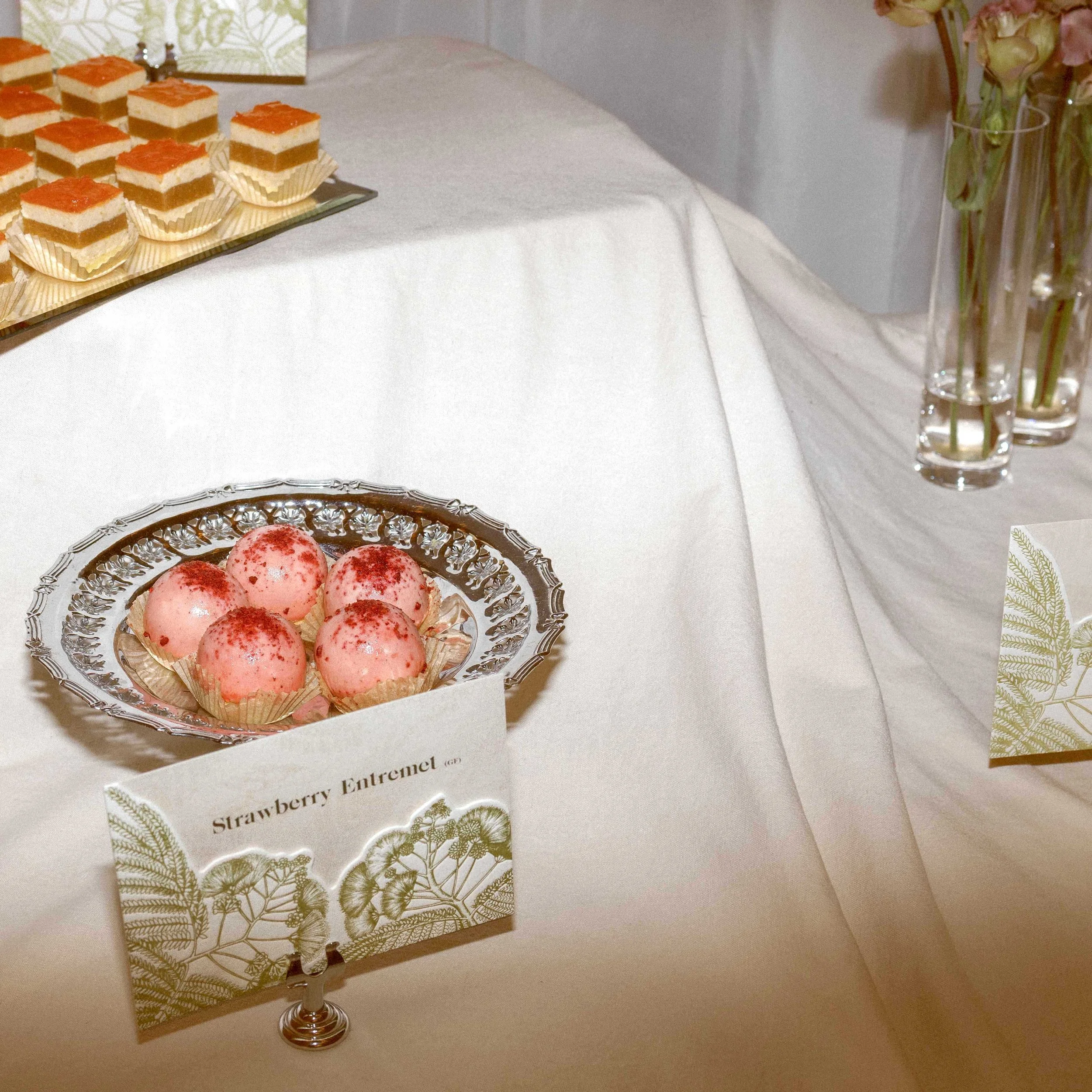Greer and Cohen’s wedding dessert display with die-cut botanical cards featuring letterpress silk tree flower illustrations.