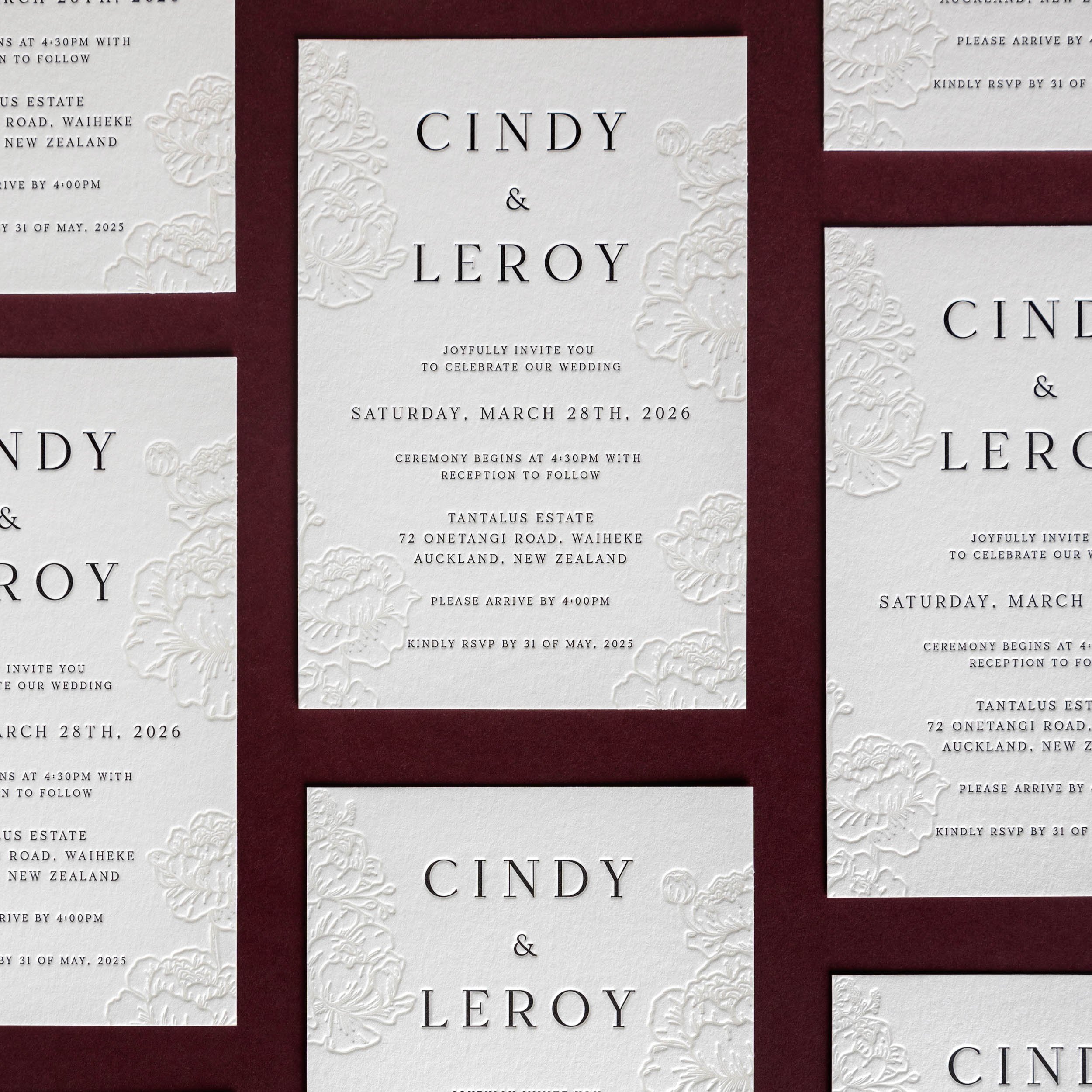 Letterpress wedding invitation with deep peony impressions and crisp black typography for a wedding at Tantalus Estate, Waiheke.