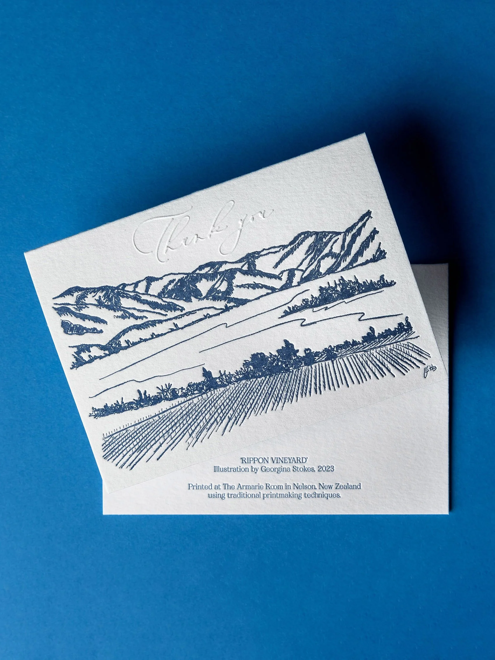 Letterpress thank you card with blind embossed "Thank you" lettering and a hand-drawn landscape illustration inspired by Rippon in Wānaka.