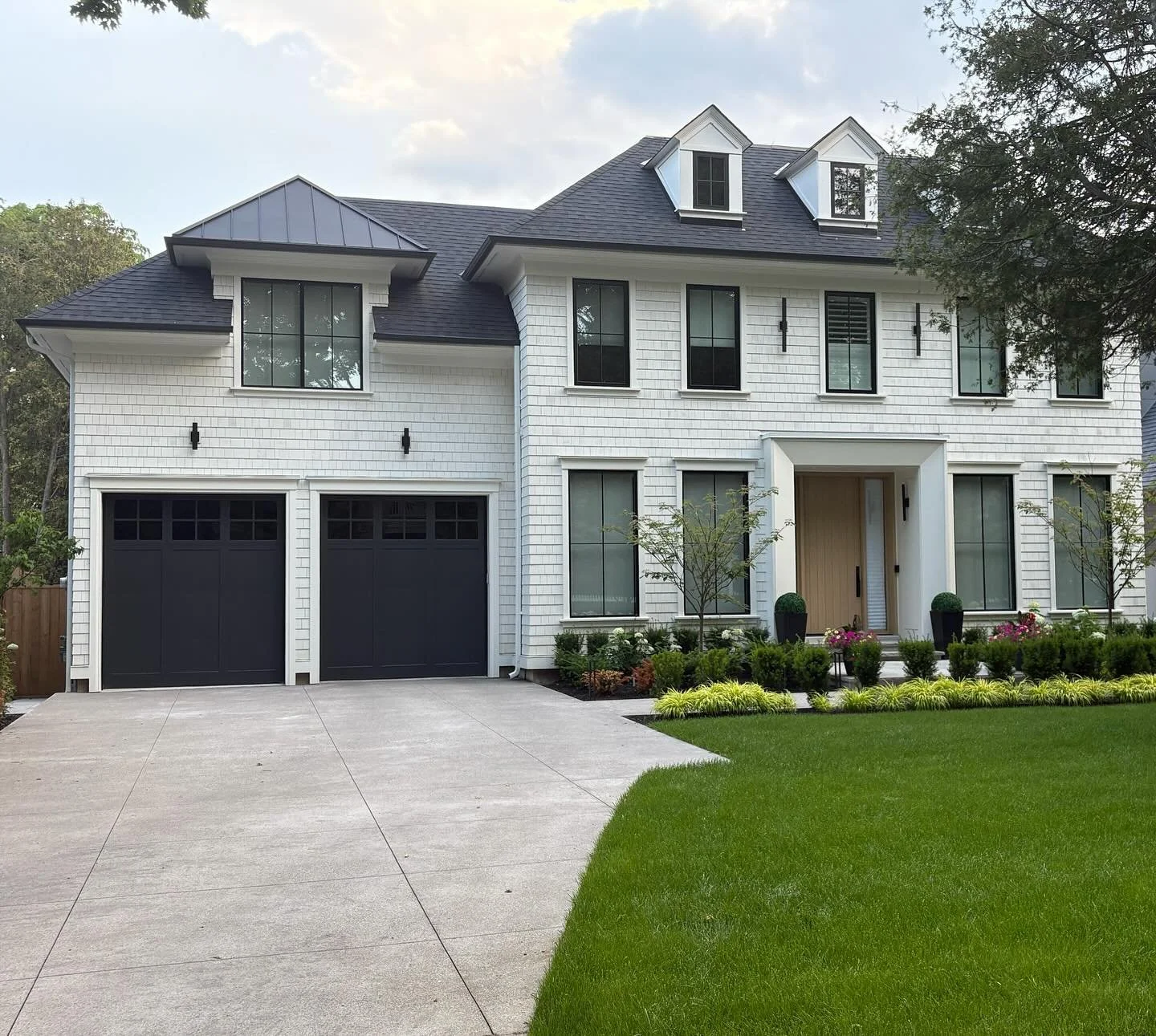 Happy Friday! We&rsquo;re wrapping up the week by sharing a peek at this recently completed exterior.

Set in a heritage district, this home brings together a balance of classic charm, and modern simplicity. The traditional Georgian-style entry gets 