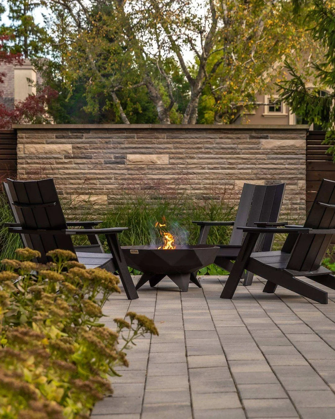 Extend the season.

Architectural thinking carries through every detail, including the furniture we select. At Project Forestwood, a geometric fire bowl adds sculptural form to the seating area, creating a space that invites you to linger a little lo