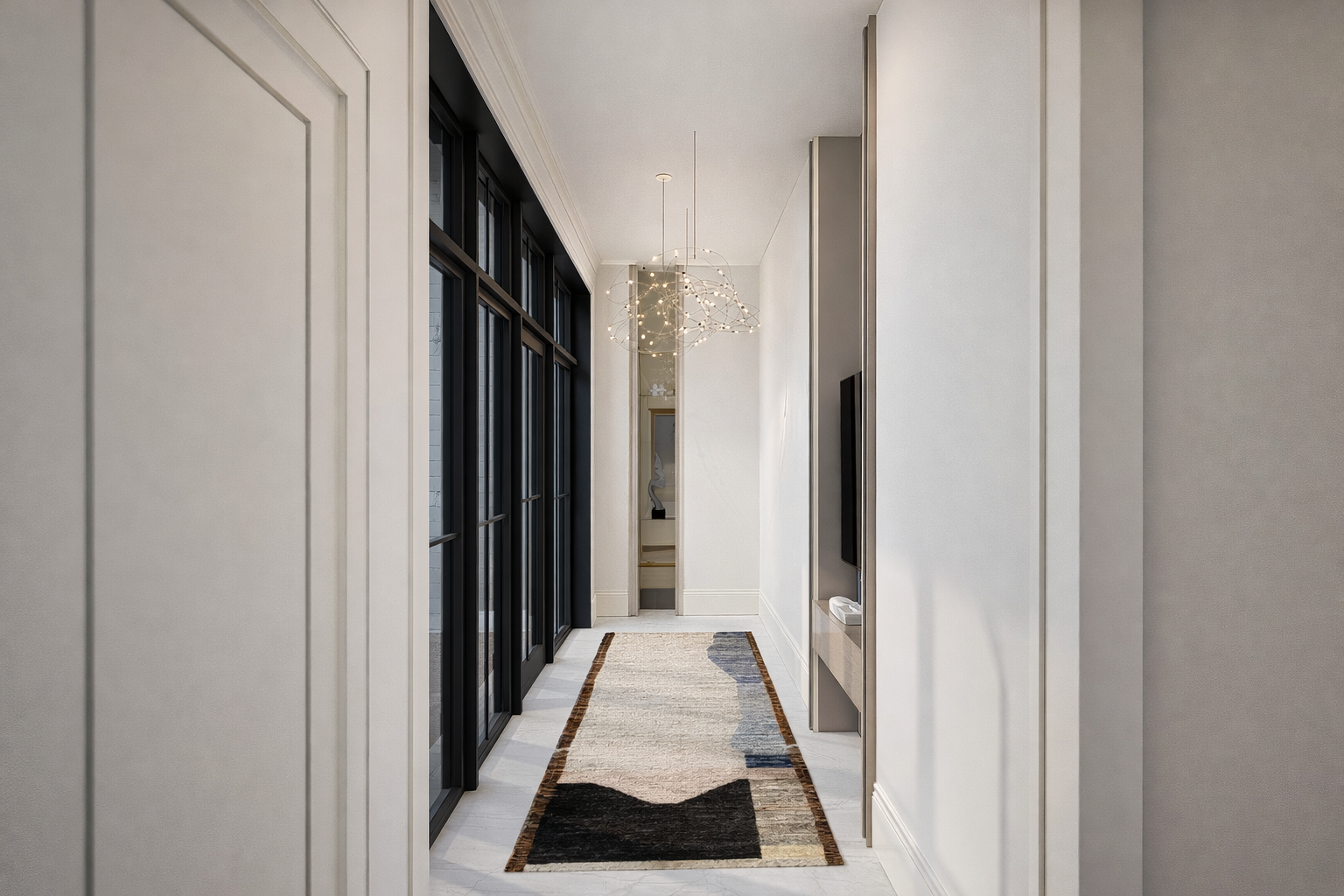 Modern hallway with white walls, a colorful runner rug, and black-framed glass doors on the left, a contemporary chandelier hanging from the ceiling, and a wall-mounted TV on the right.