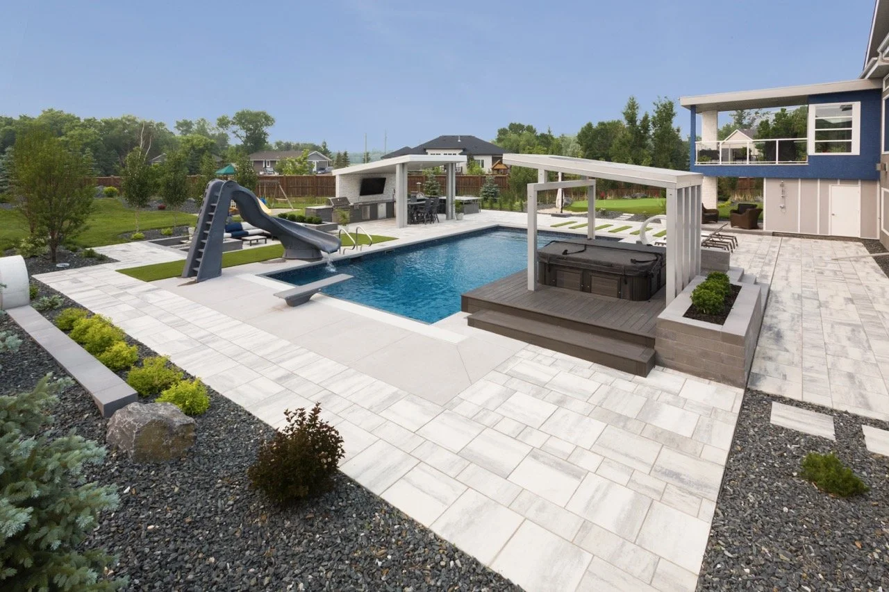 Backyard with pool, slide, and hot tub