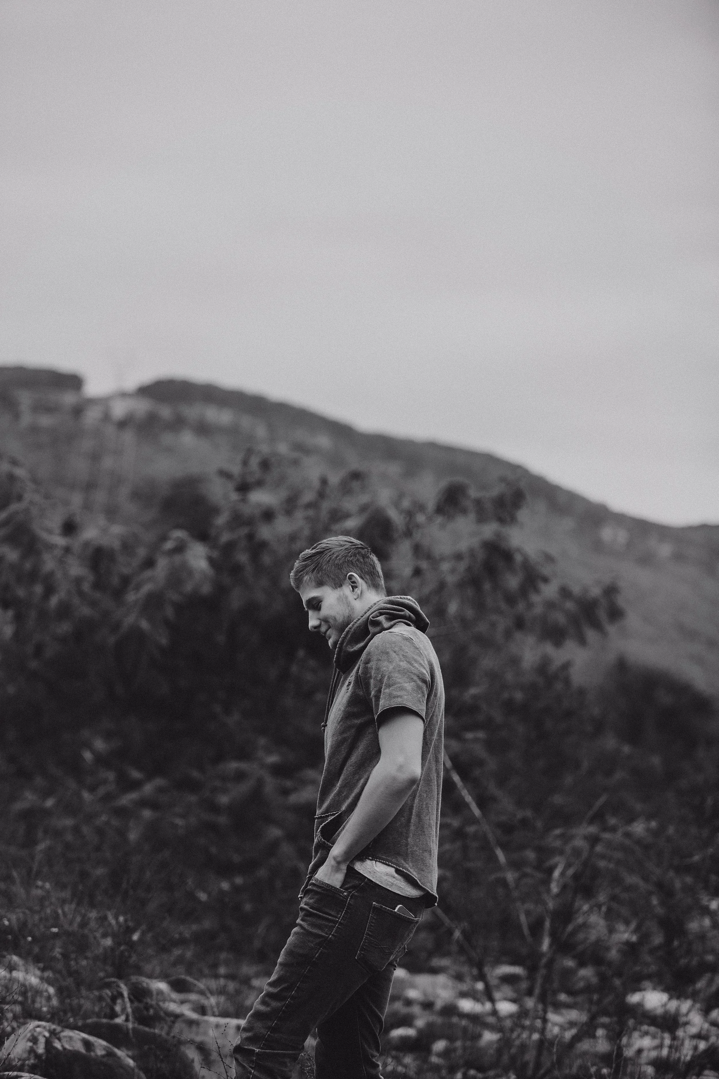 High school senior boy walking on the river