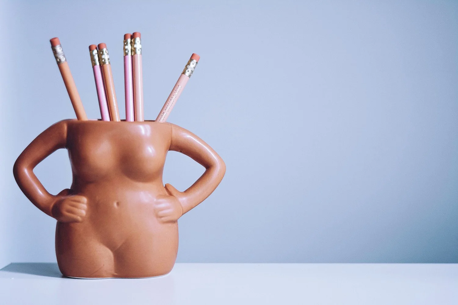 Unique pencil holder: a female torso with arms akimbo. Bold and decisive. Just like SmallBiz Sidekick and clients.