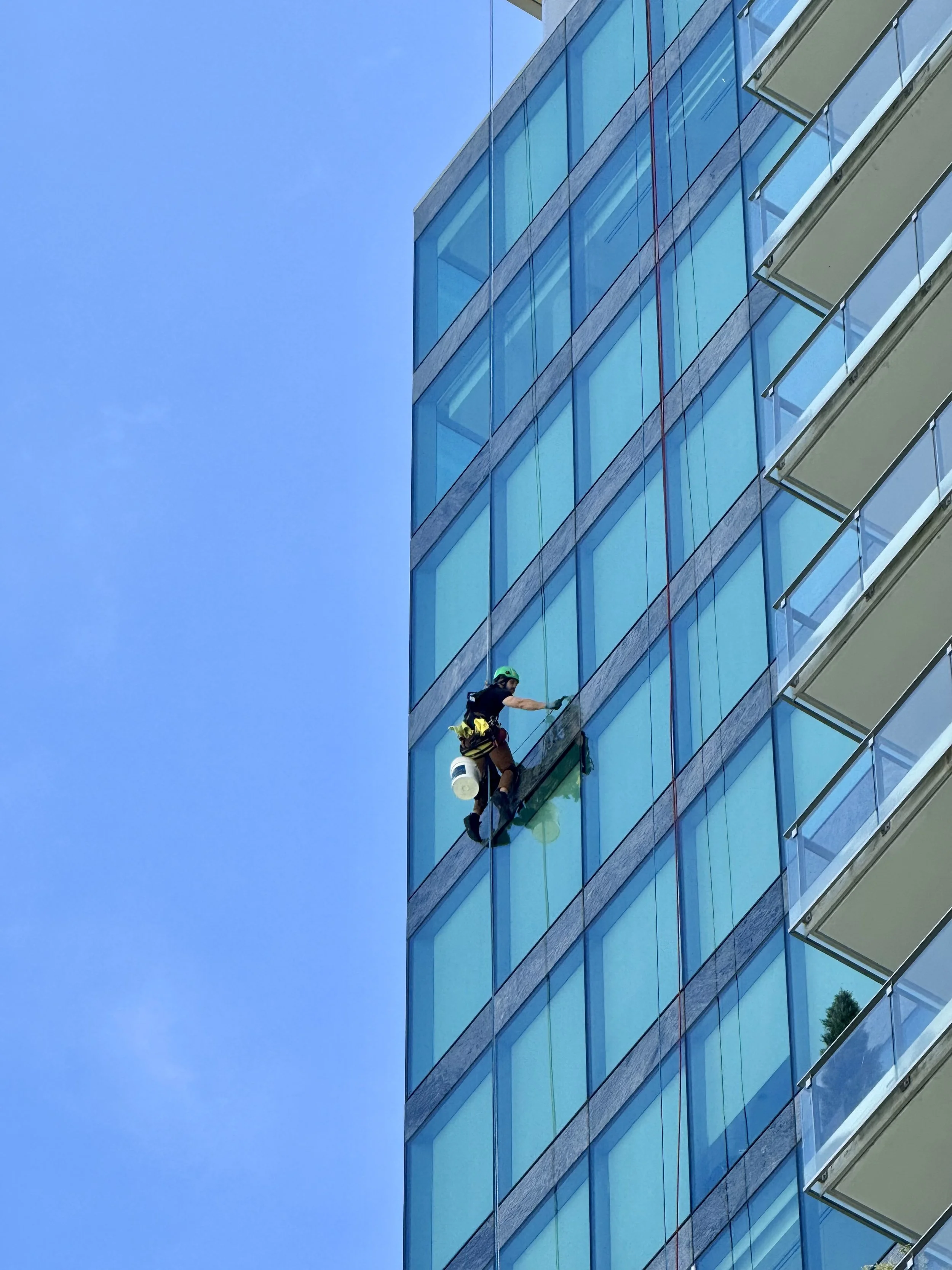 High-rise window cleaning using rope access downtown Vancouver tower