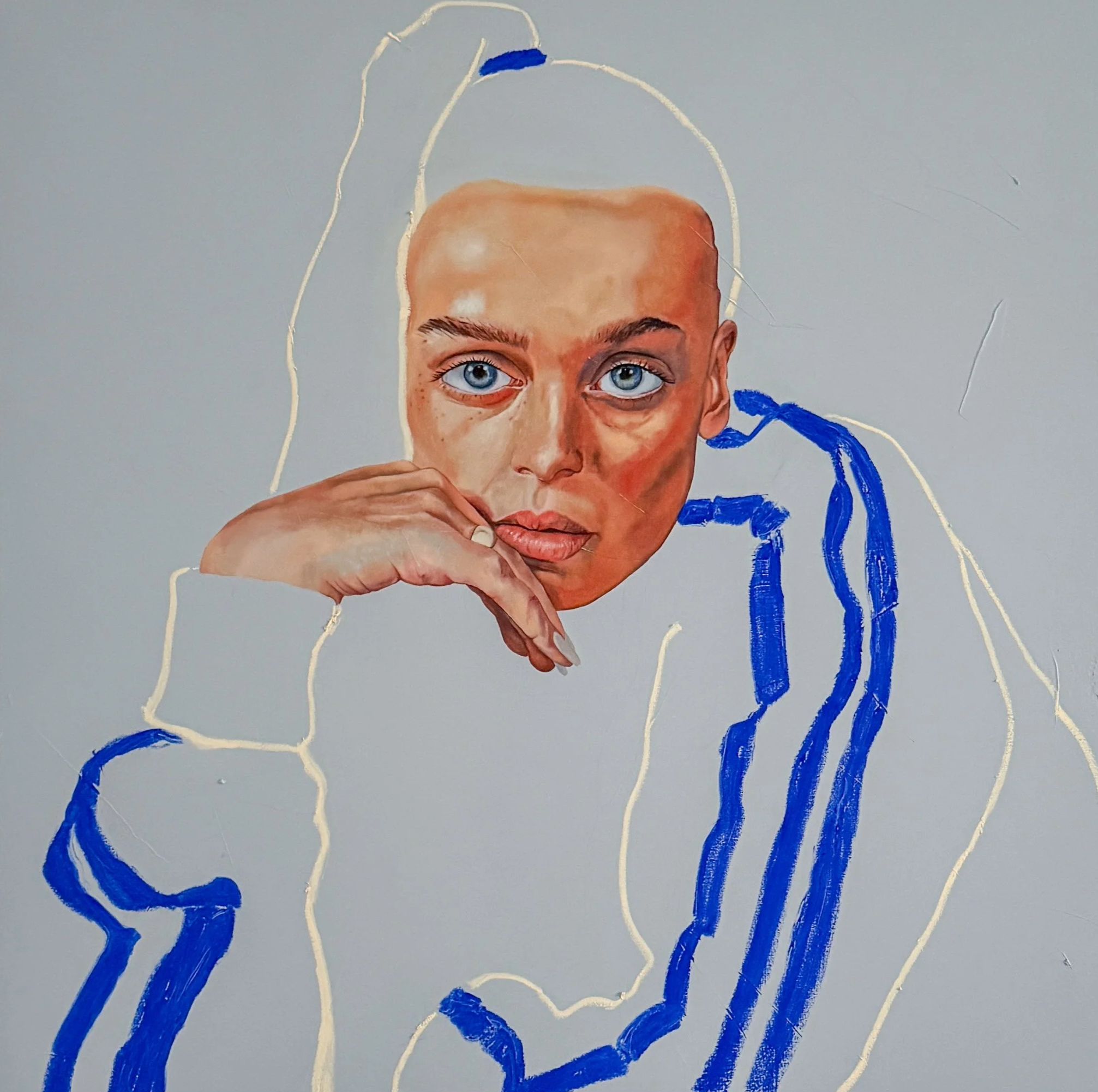 Mixed media artwork featuring a detailed painted face of a woman with blue eyes, partially covered by hand, with abstract blue and white line designs in the background.