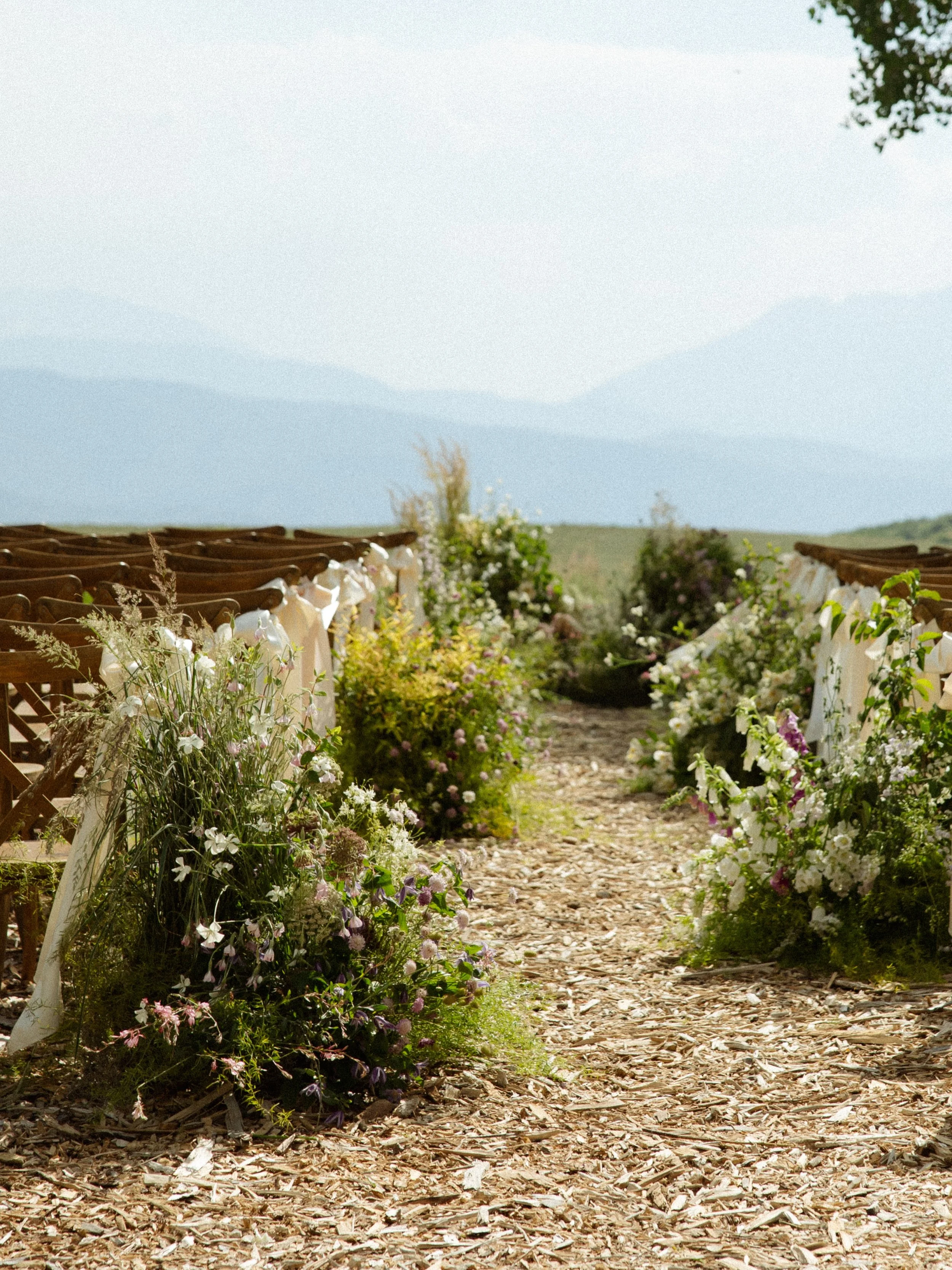 For H + J, the flowers were meant to speak for themselves.

Hannah wanted the florals to be the focal point &mdash; abundant, colorful, and immersive. The goal was to create a celebration where you felt completely enveloped in blooms, with each arran