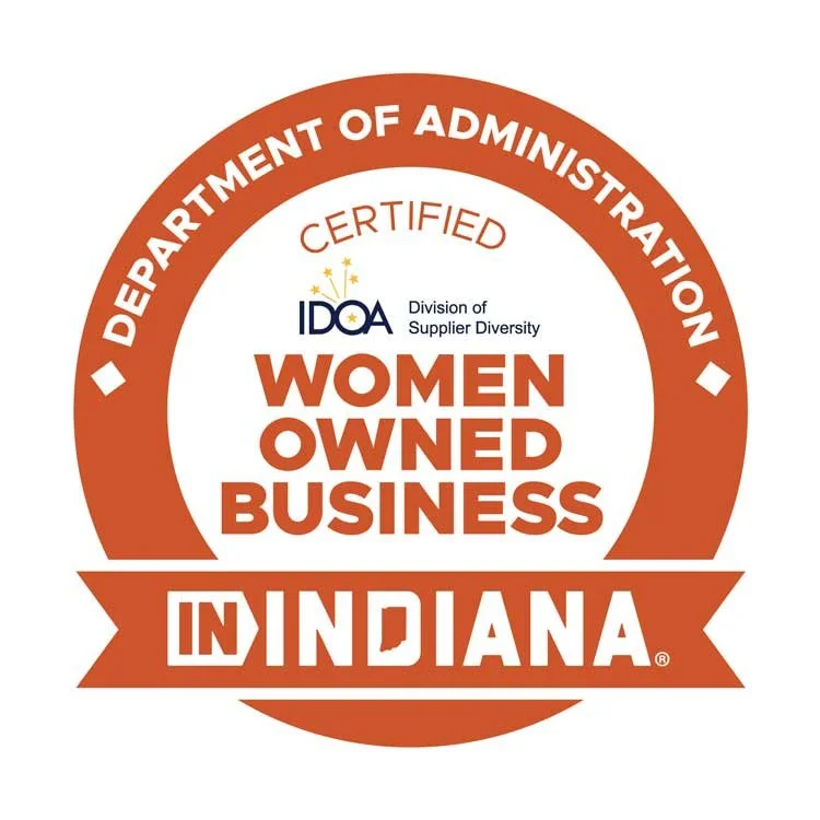Orange badge indicating women-owned business certification from the Indiana Department of Administration