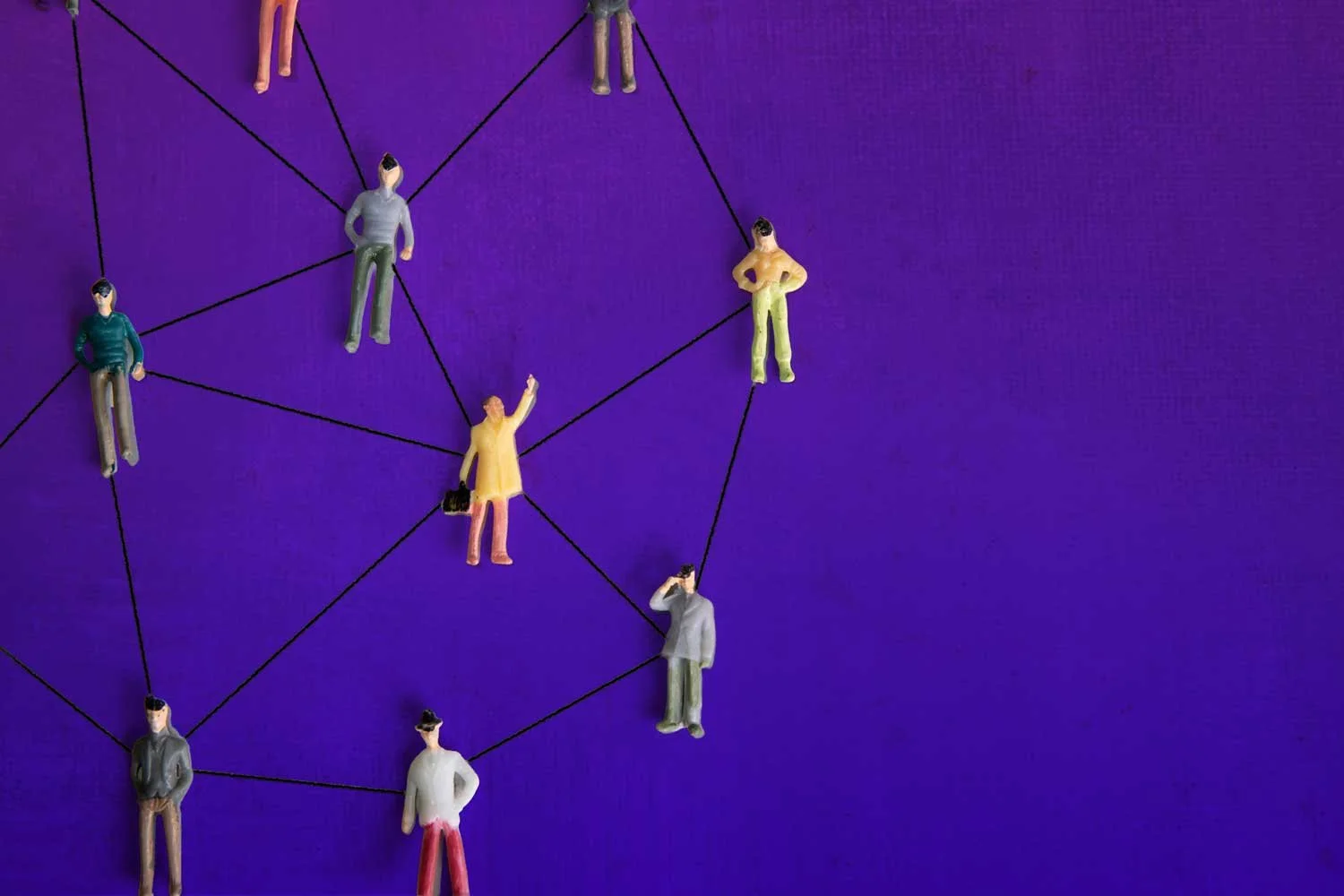 Network of figures on painted purple background