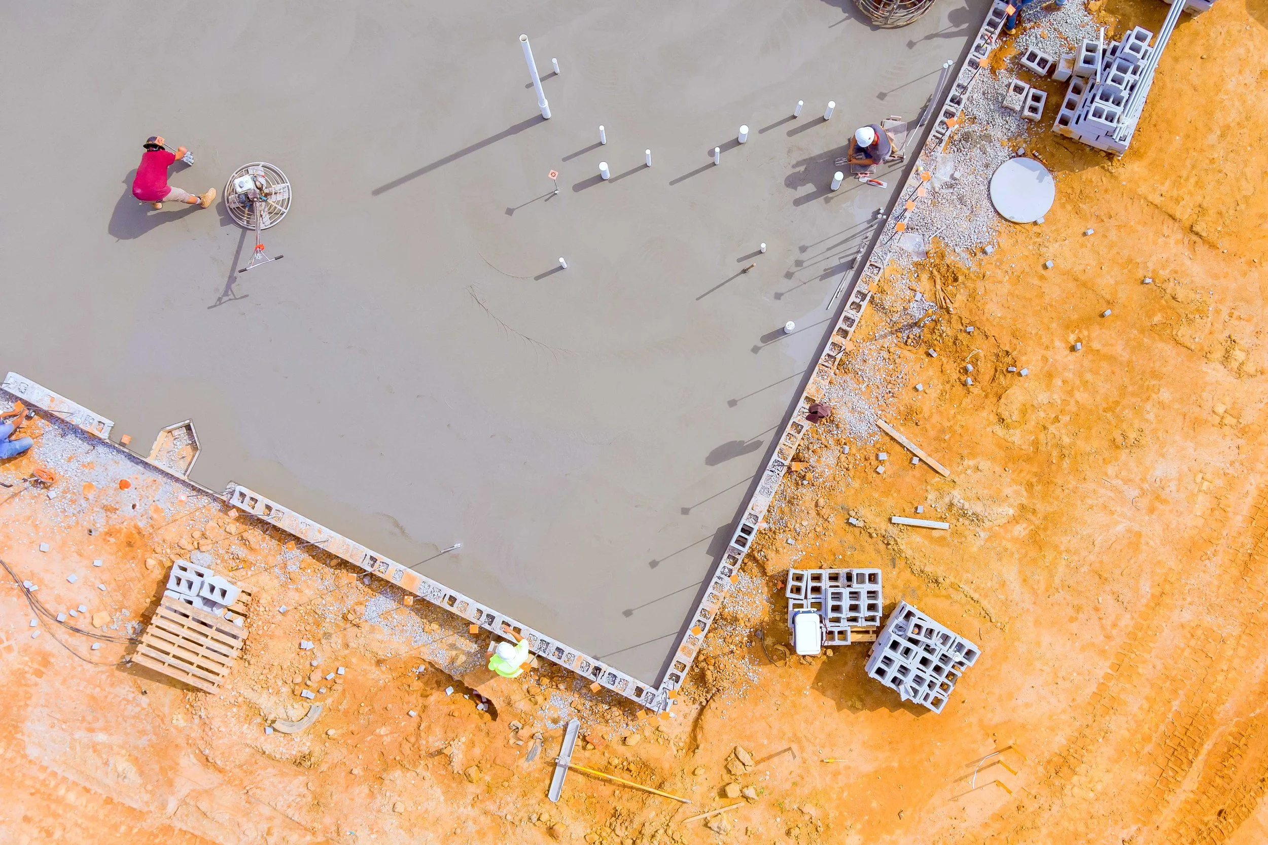 construction-workers-leveling-concrete