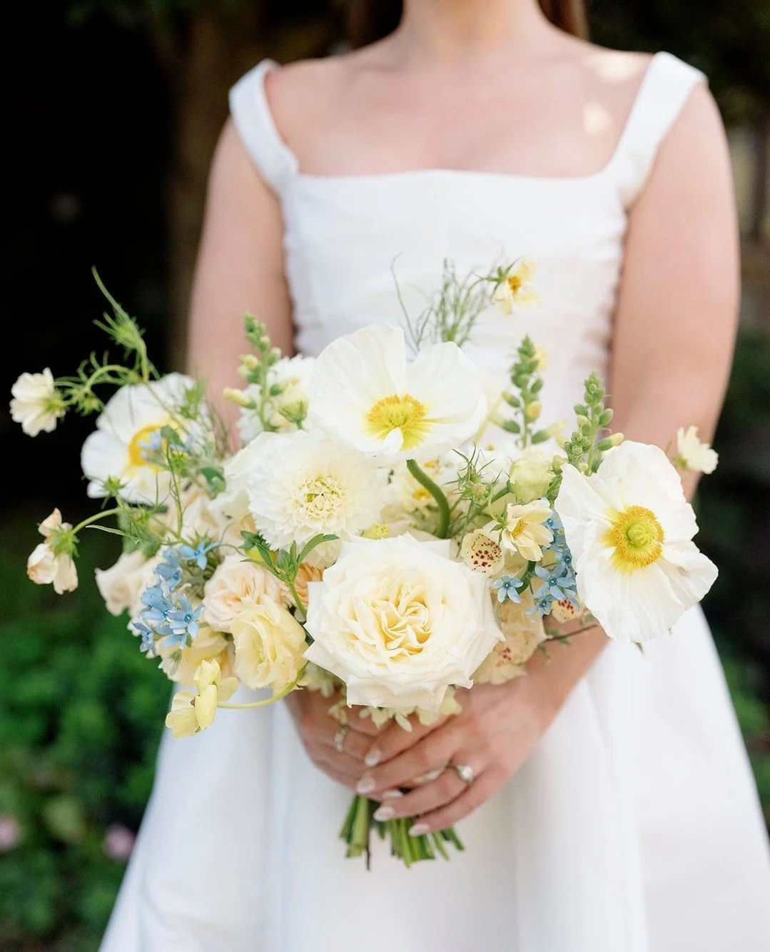 Soft butter yellow blooms paired with delicate pops of blue made this bridal bouquet feel oh so fresh!⁠
⁠
Planning | ⁠@stylearchitectsweddings⁠
Venue | ⁠Twin Cities Polo Club⁠
Photography | @amandanippoldtphoto⁠
Catering | @forkandflairmn⁠
Bar | @ste