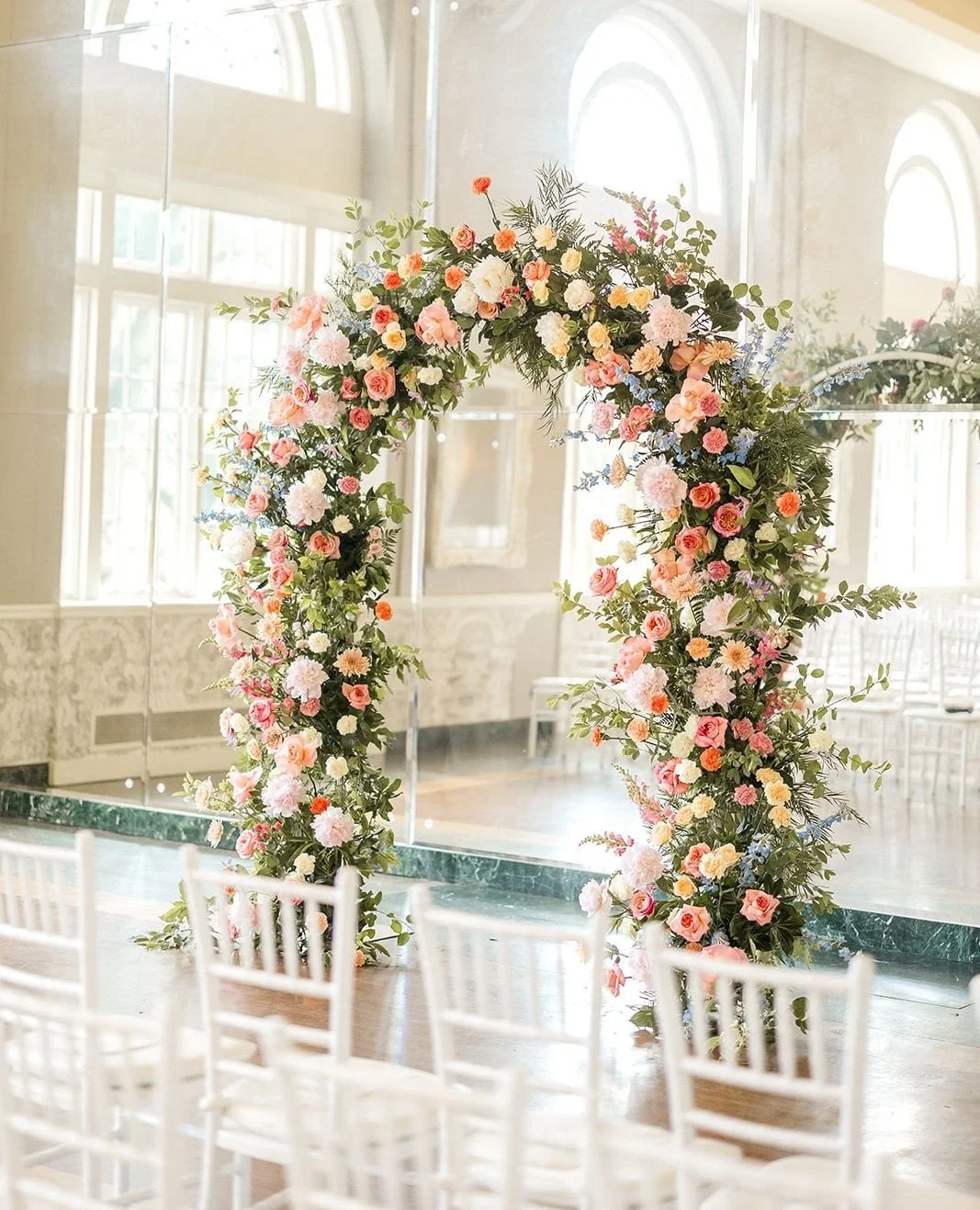 These stunning blooms framed the couple from ceremony through dinner! ⁠
⁠
Planning | ⁠@stylearchitectsweddings⁠
Venue | ⁠@thebeachclubevents⁠
Photography | @alexandrarobynphoto⁠
Videography | @summithillstudios⁠
Catering &amp; Cake | @damicocatering⁠