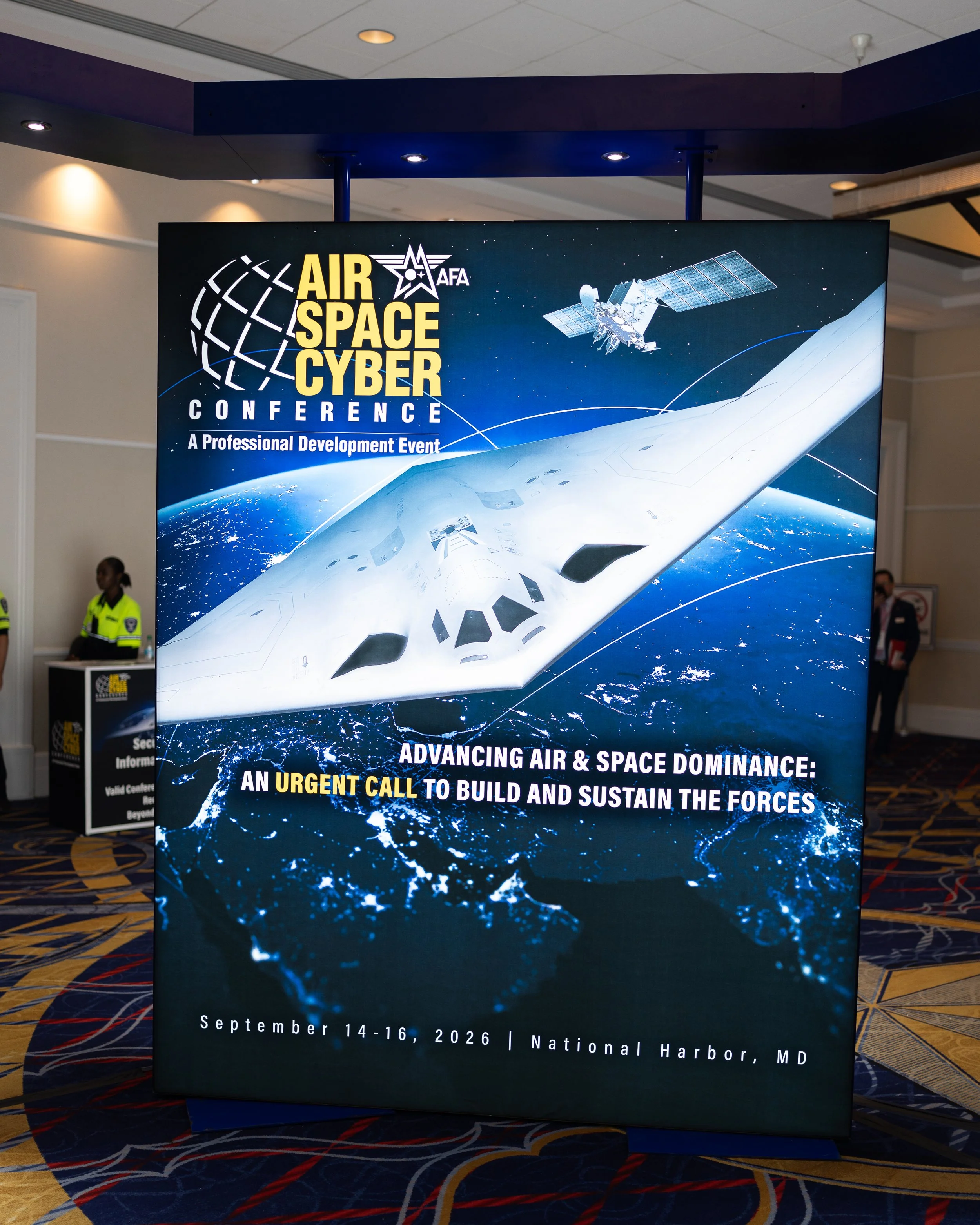 Conference banner for the Air, Space, and Cyber Conference, showing a spacecraft, Earth, and a satellite orbiting in space. The event is scheduled for September 14-16, 2026 at the National Harbor in Maryland.