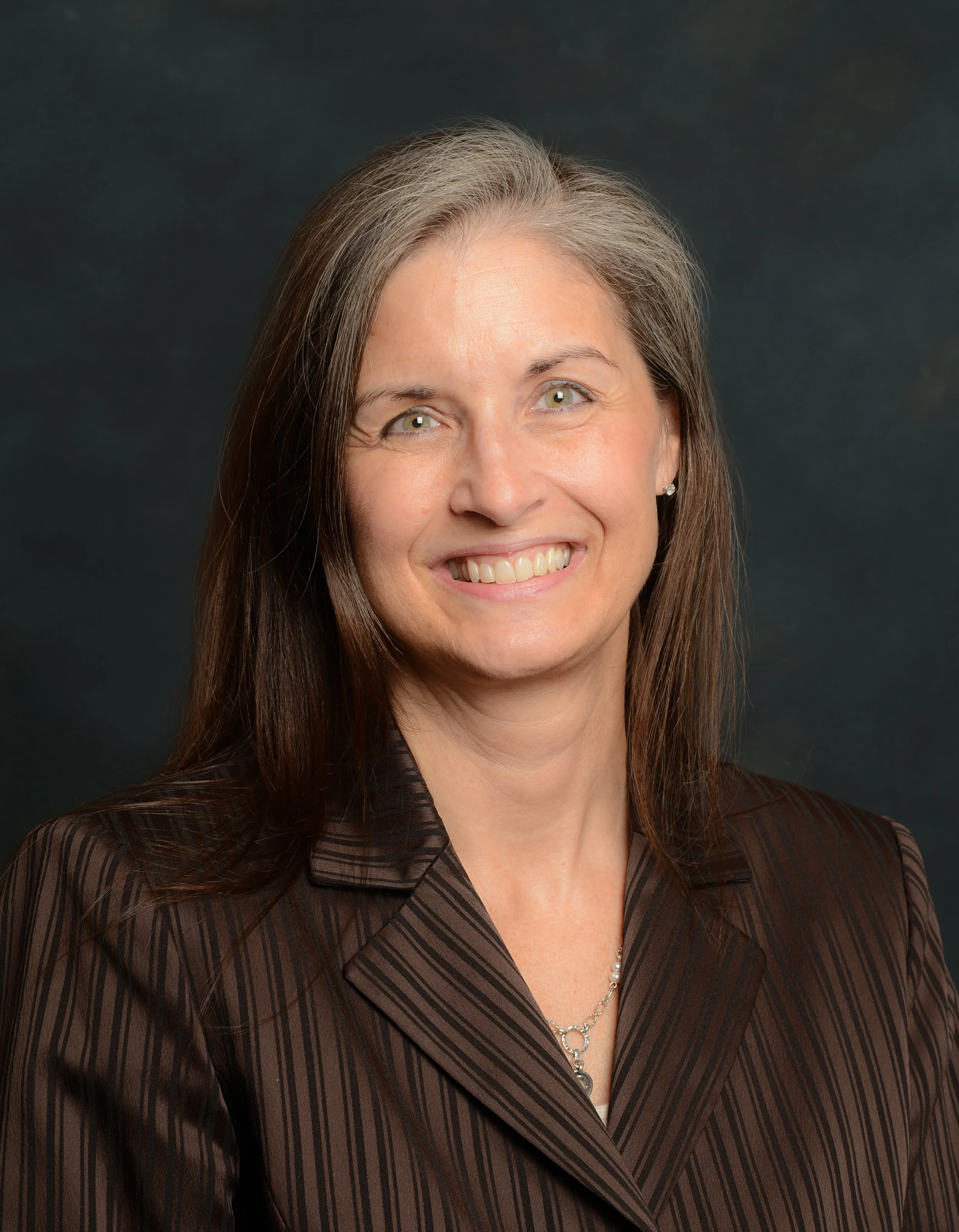 Portrait of Susan Crews, minister and licensed mental health counselor with Divine Earth Church.